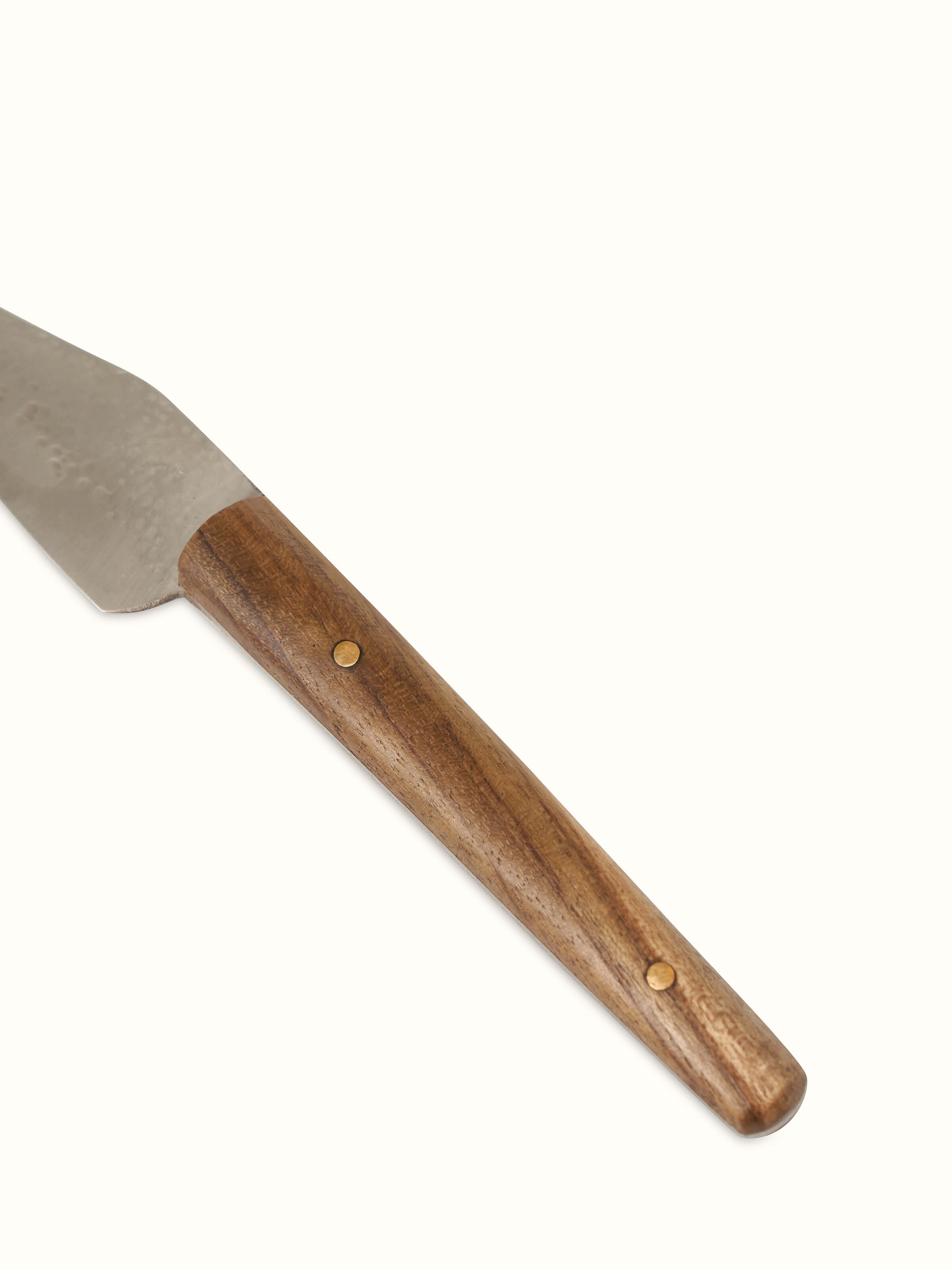 Angle view of Reha stainless steel chef's knife displaying its sleek design and stainless steel finish.