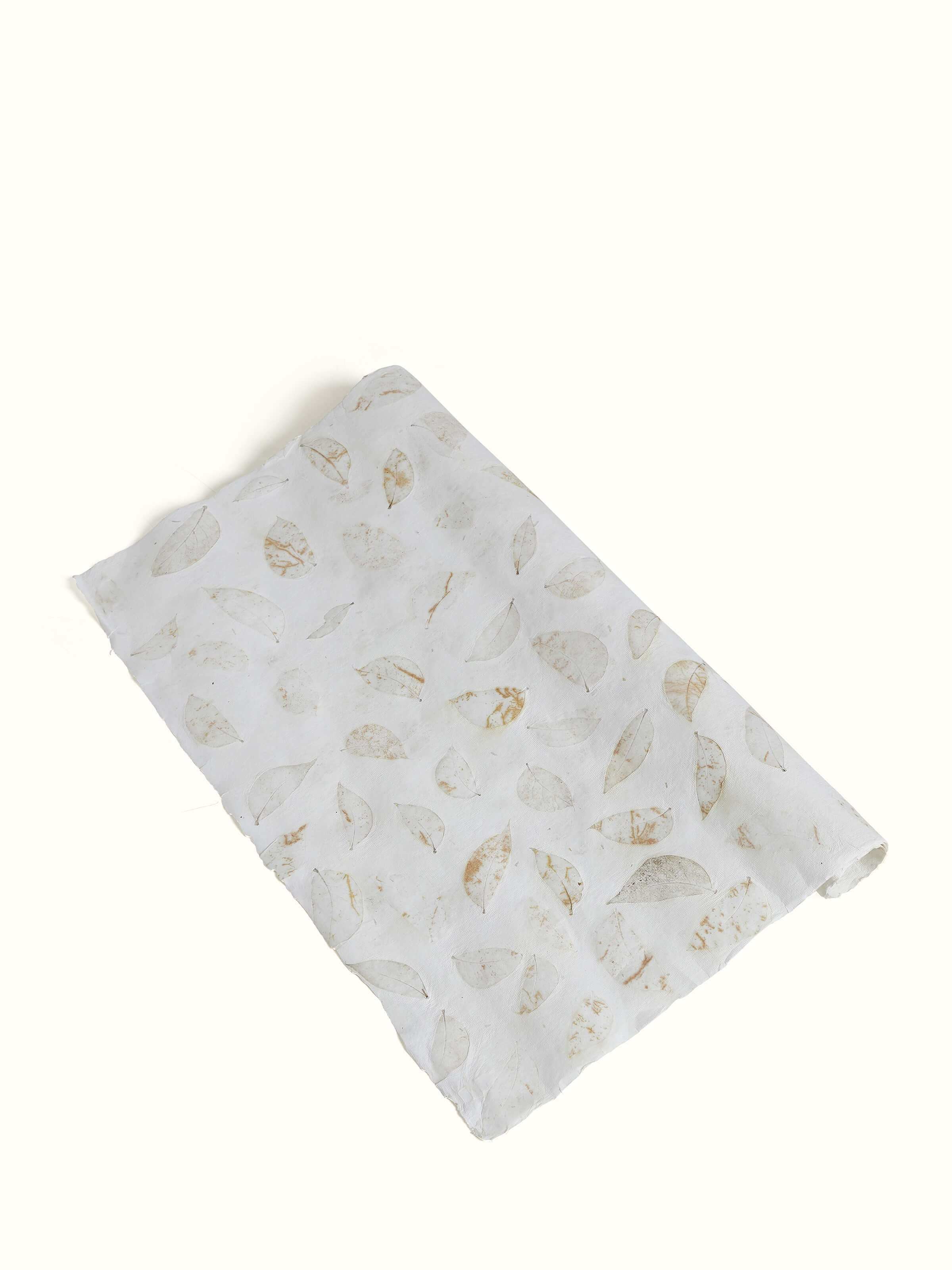 Angled view of Auroville Handmade Paper Wrapping Sheets in White (2 pcs) with detailed close-up.