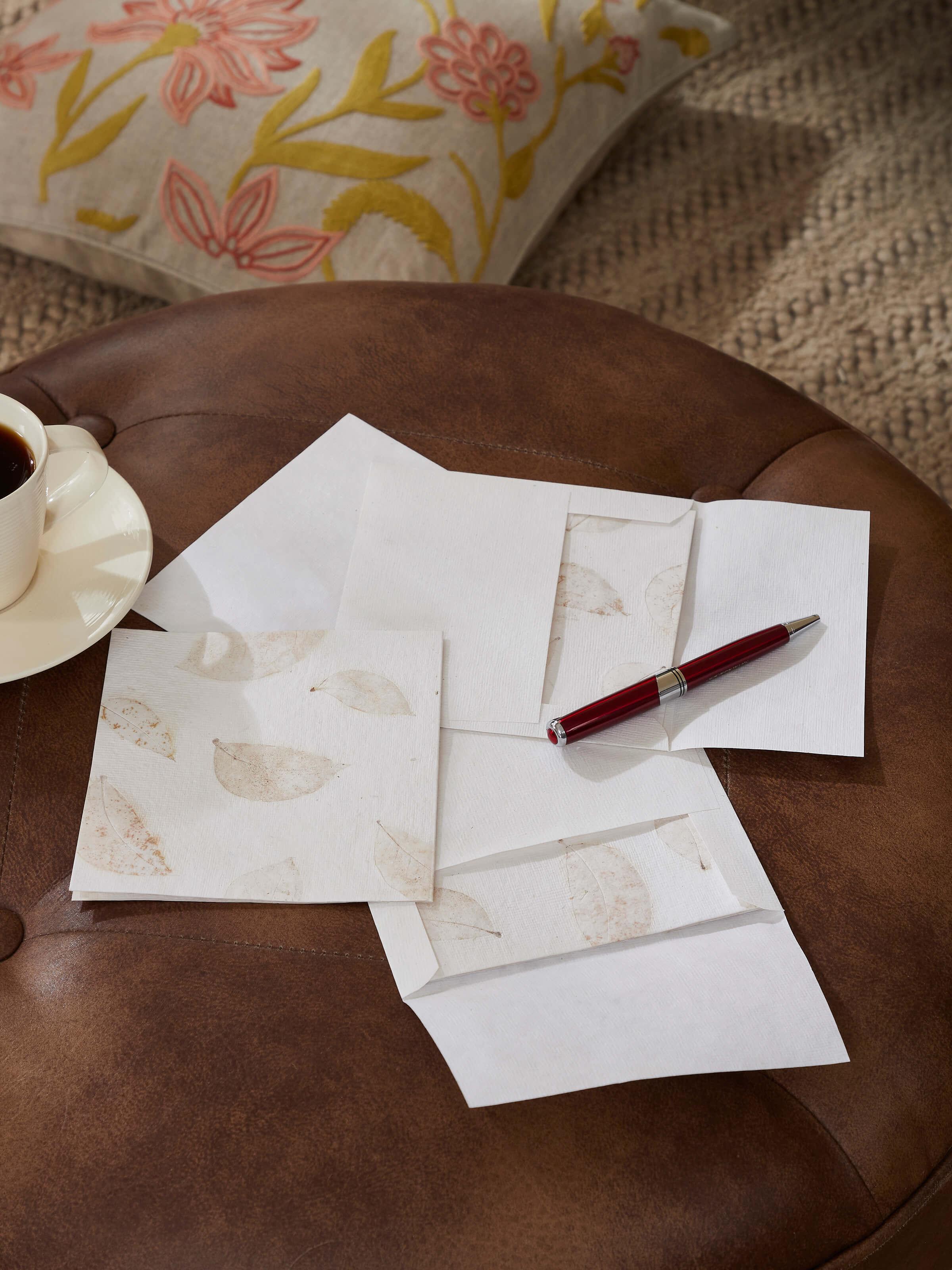 Side view of Auroville Handmade Paper Money Envelopes in White (3 pcs) highlighting texture.