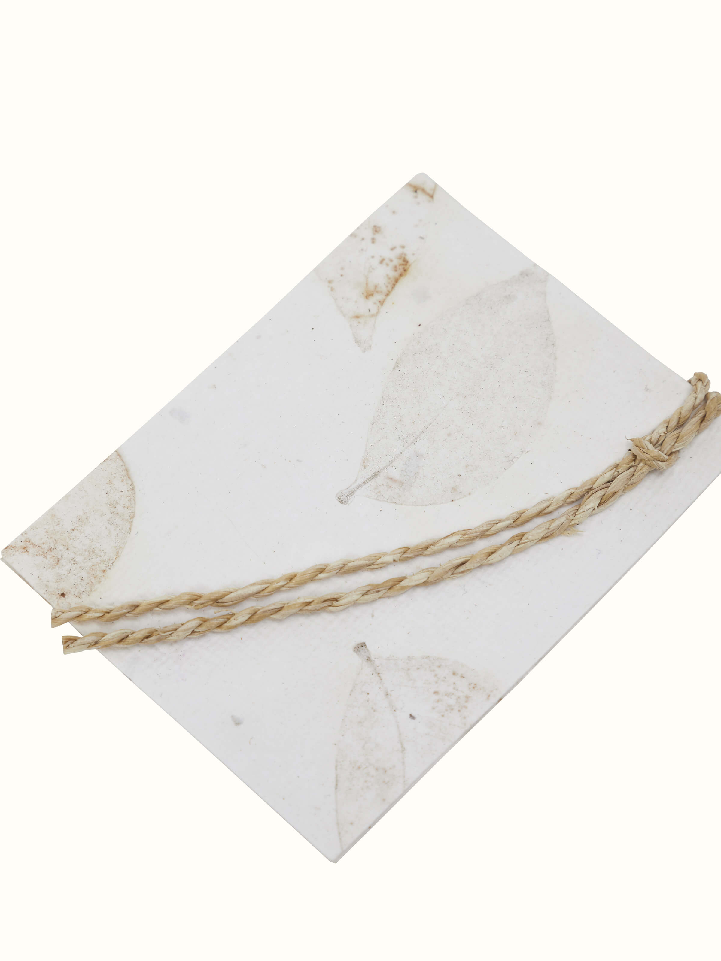 Close-up of Auroville handmade paper gift tags in white (set of 5) with intricate design.