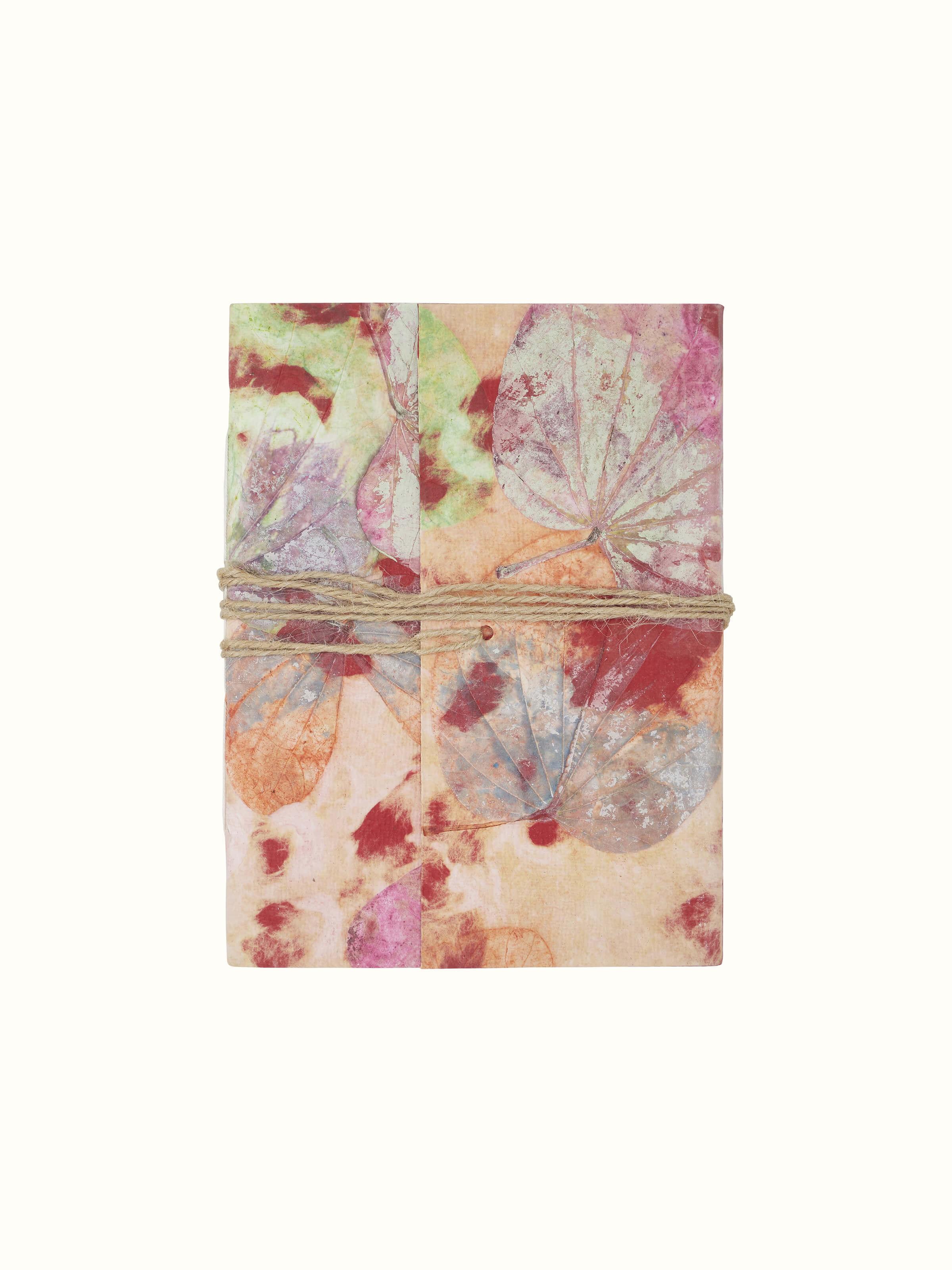 Top view of Auroville Handmade Paper Notebook pink, showcasing the cover and overall design