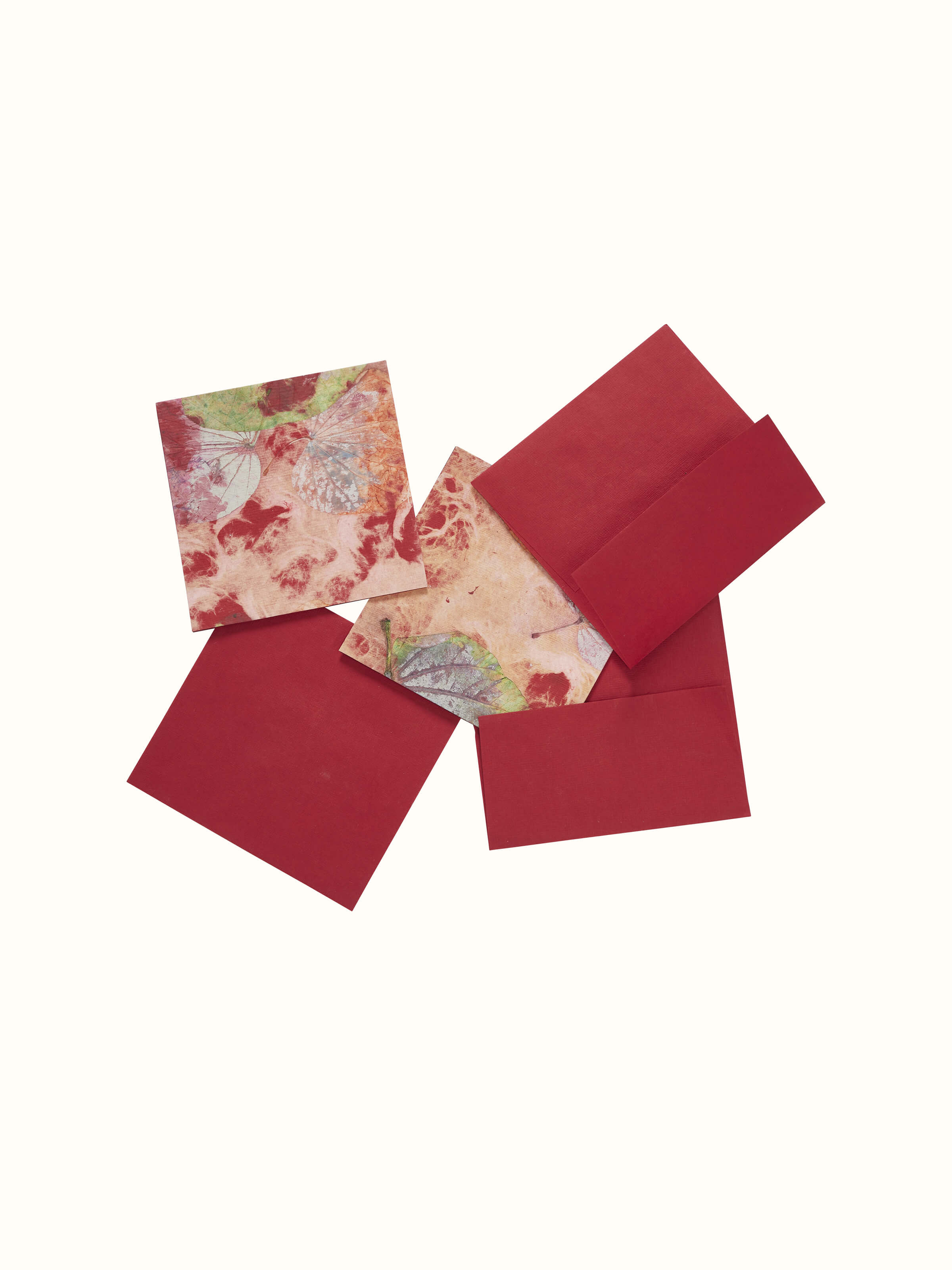 Close-up of Auroville Handmade Paper Money Envelope in red, focusing on the intricate details and craftsmanship