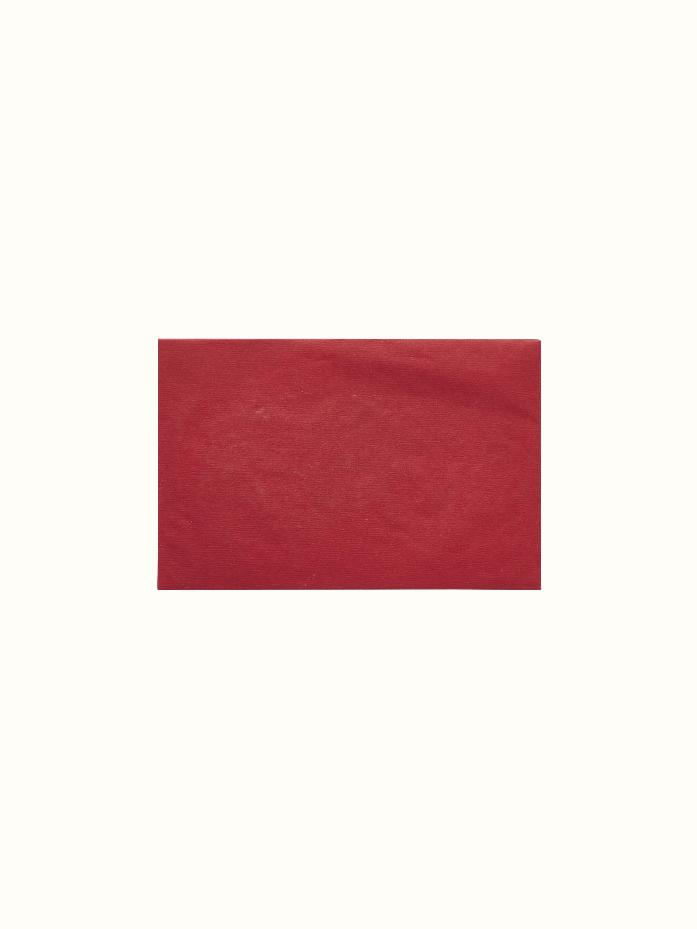 Detailed view of Auroville handmade paper money envelopes in red, emphasizing the elegant design and artisanal quality