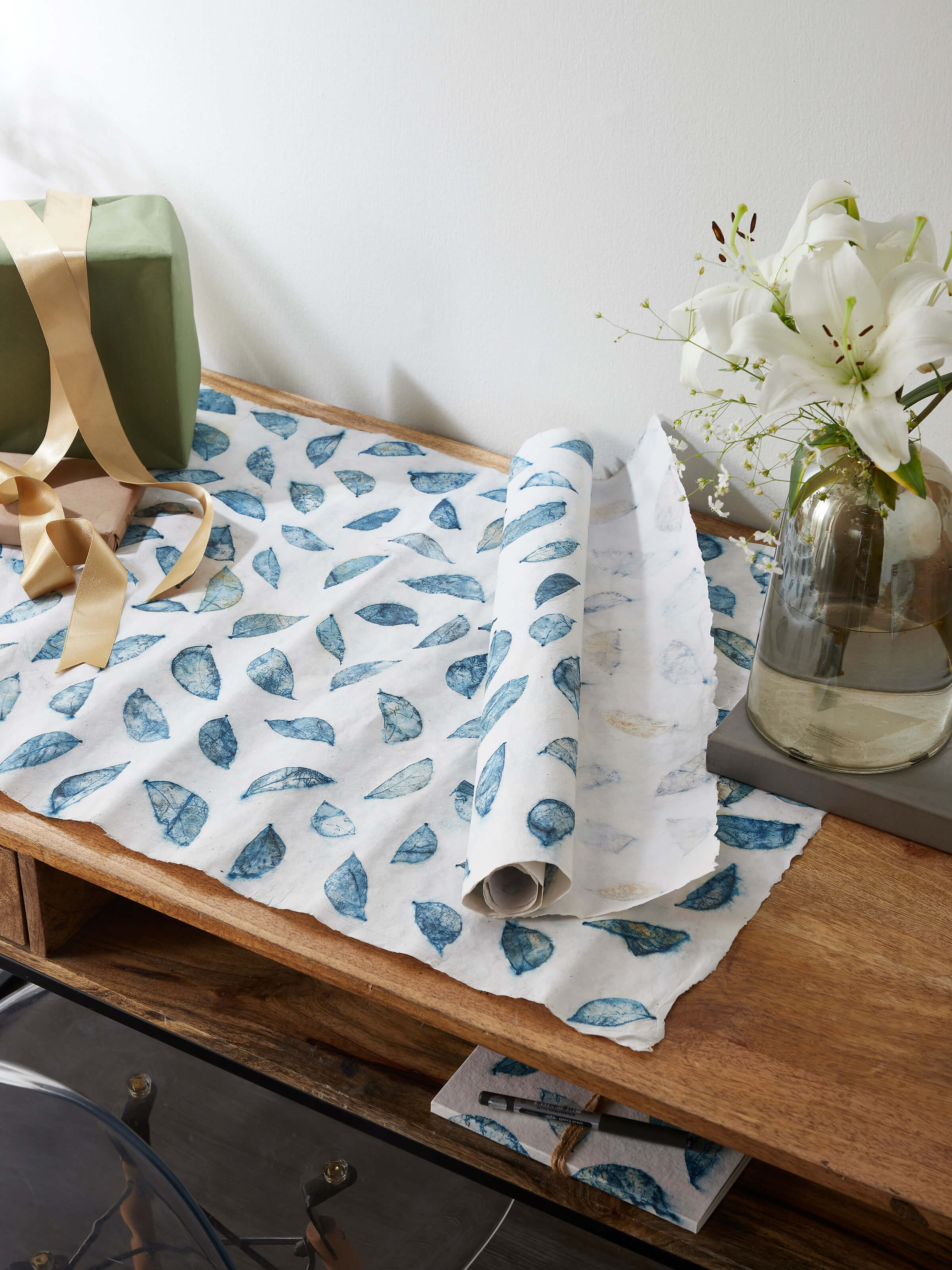 Side view of Auroville handmade paper wrapping sheets in blue, highlighting the quality of the handmade paper