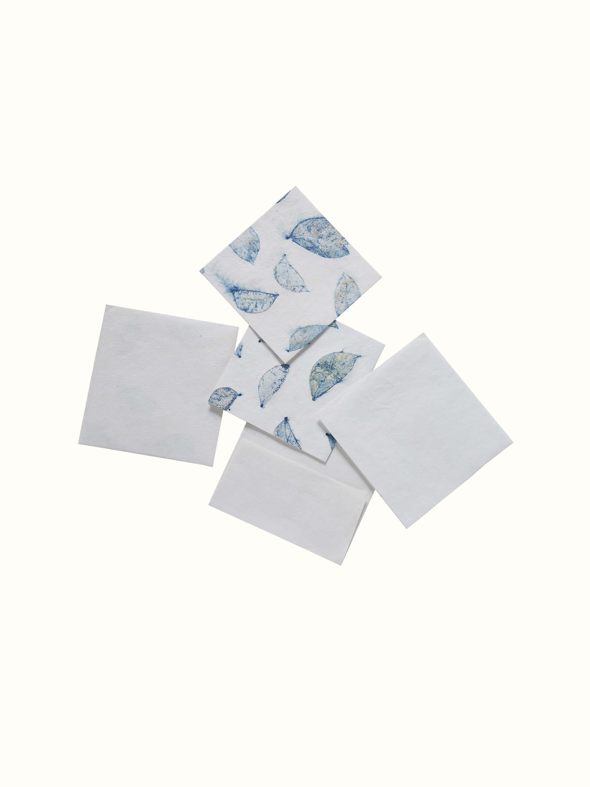 Detailed view of Auroville handmade white paper money envelopes showcasing the texture and artisanal quality