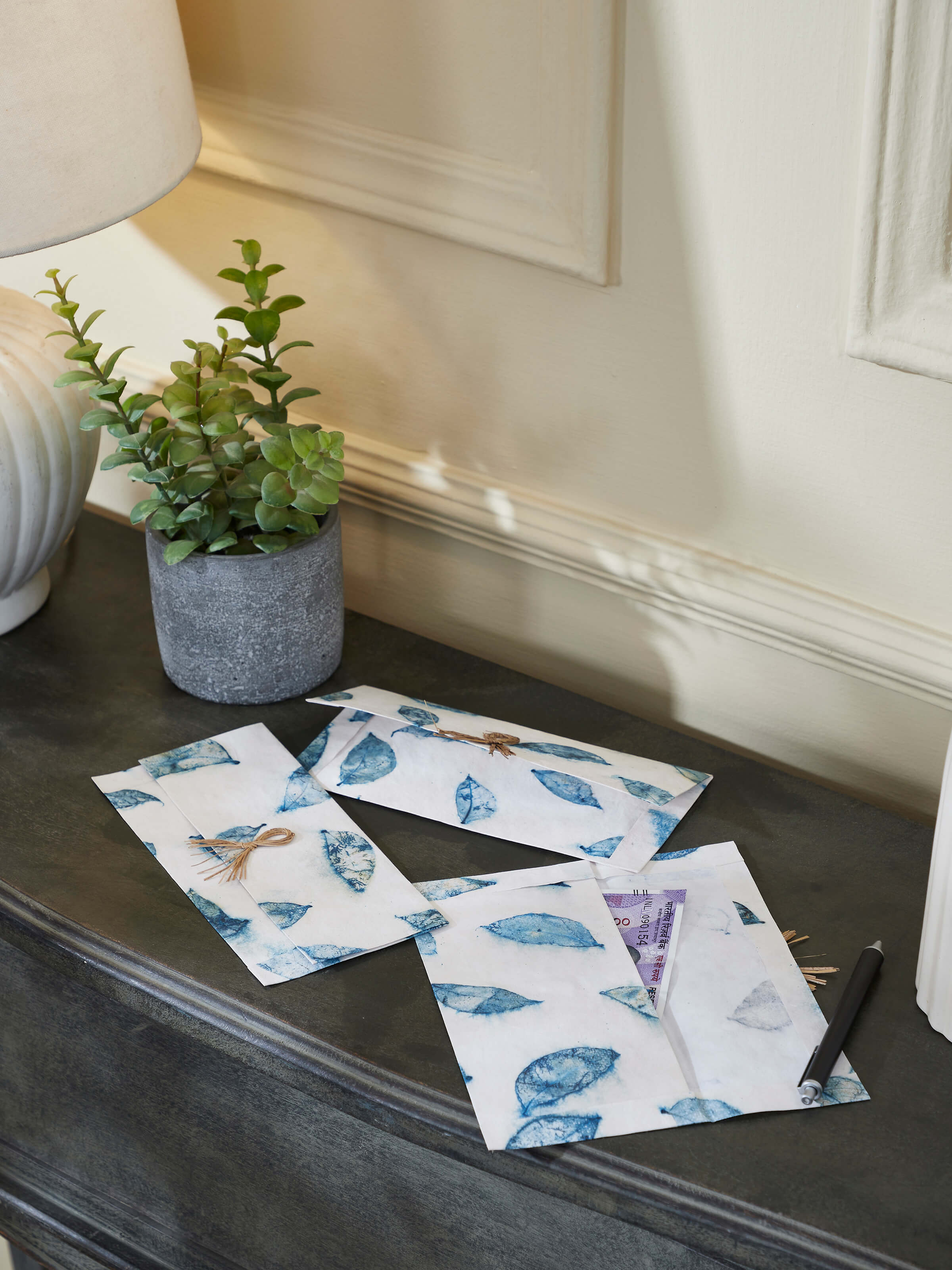 Side view emphasizing the unique craftsmanship of each envelope