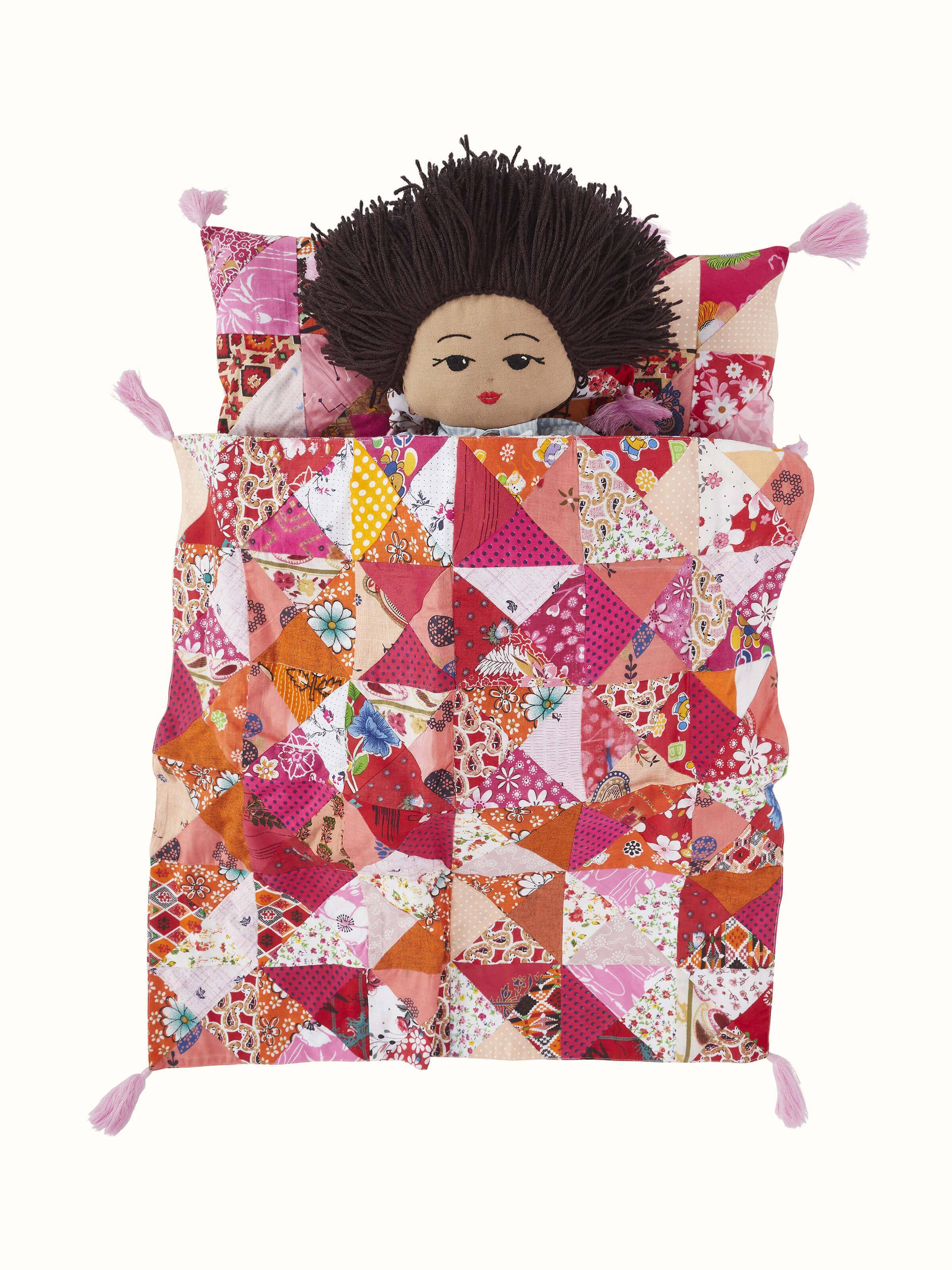 Angled view of Cotton & Polyester Baby Caring Doll Set, focusing on the quality stitching and vibrant colors.