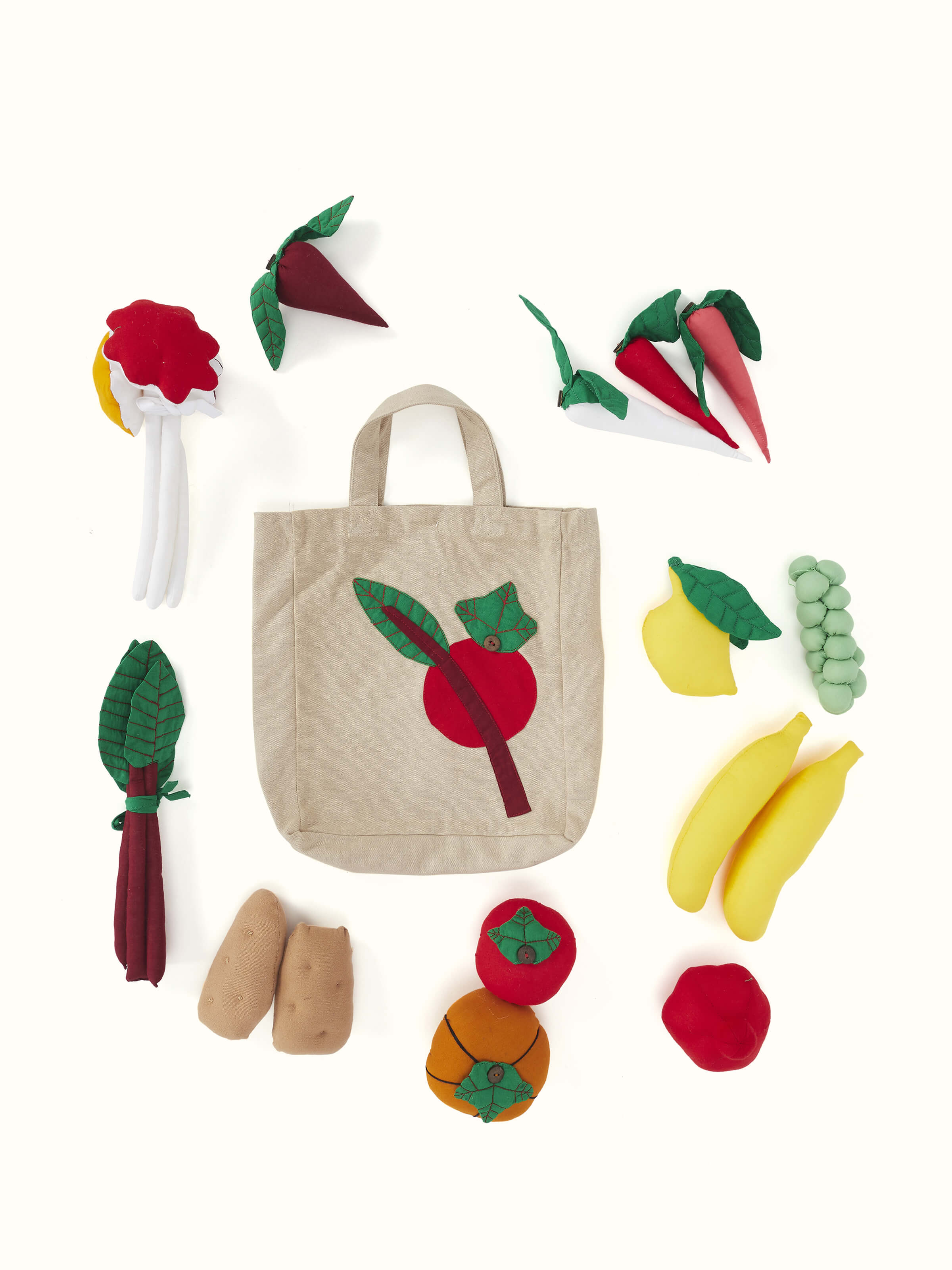 Side view of Cotton & polyester doll set in pink, highlighting the detailed design and stitching.