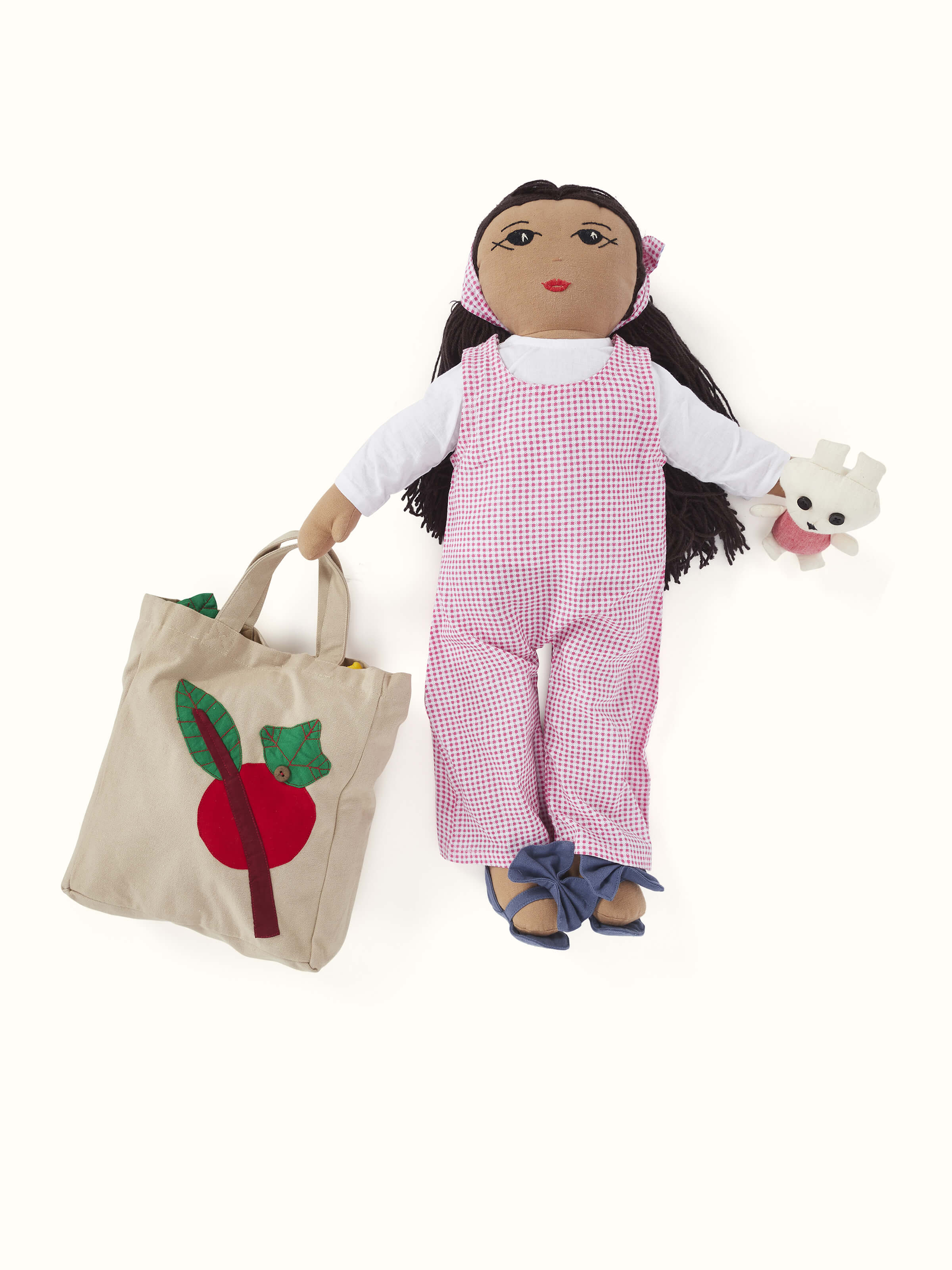 Angled view of Cotton & polyester doll set in pink, focusing on the playful design and soft texture.