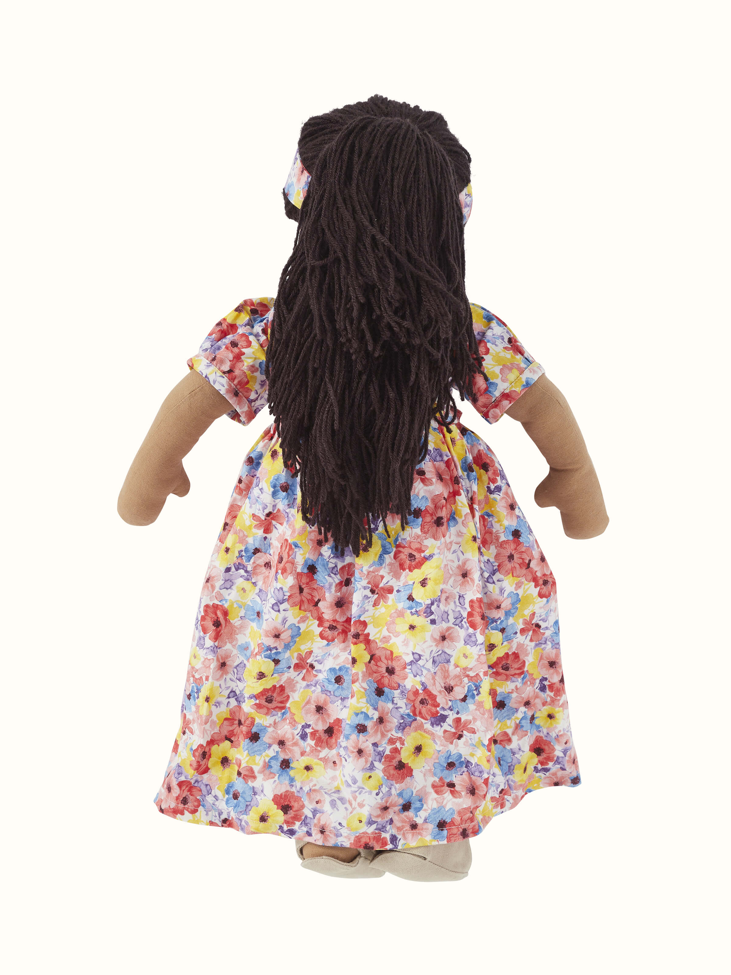 Angled view of Cotton & Polyester Doll Dress Set featuring vibrant color patterns and overall design.
