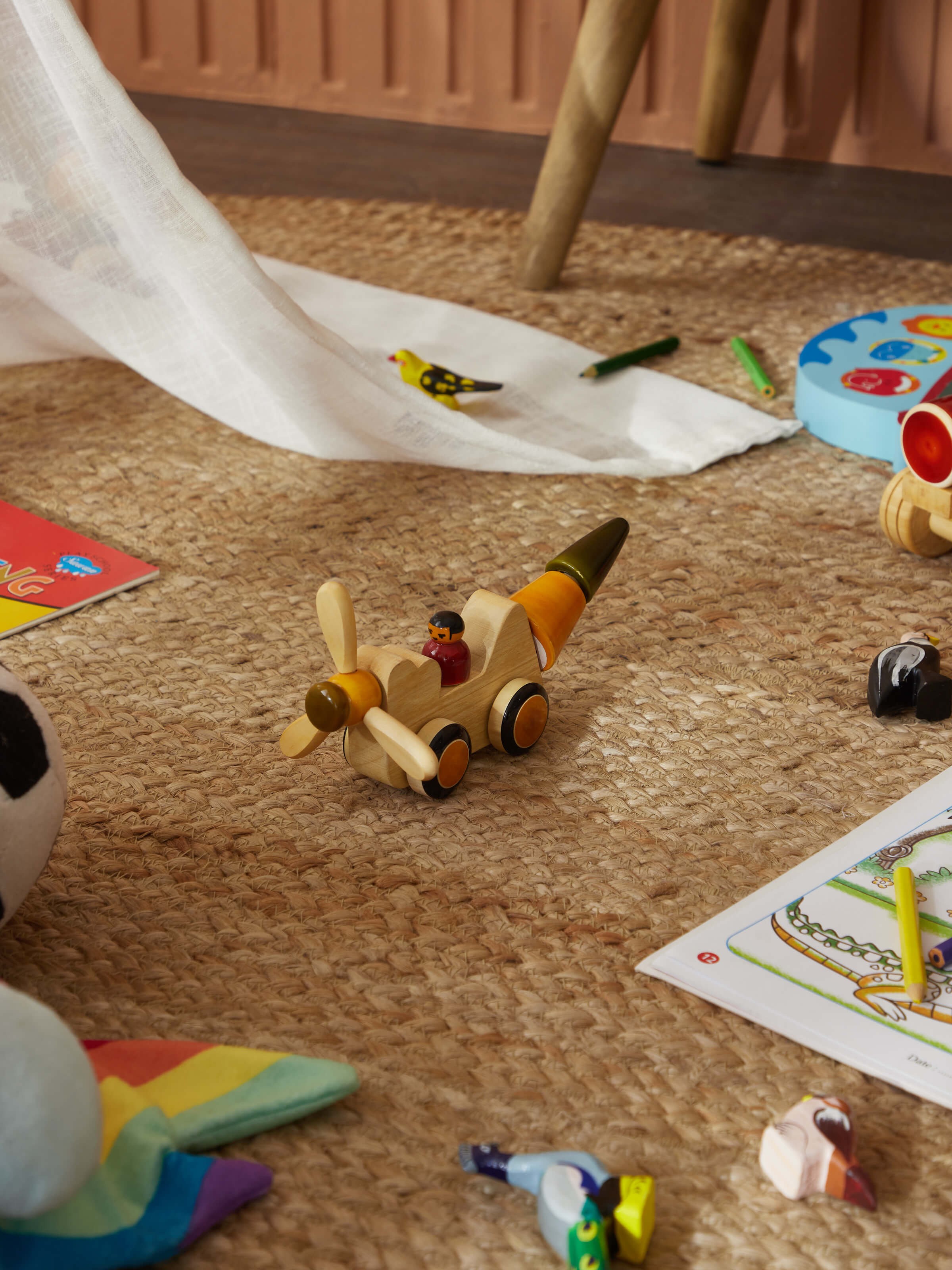 Side view of Channapatna ivory wood chip chop yellow showcasing intricate woodwork and color