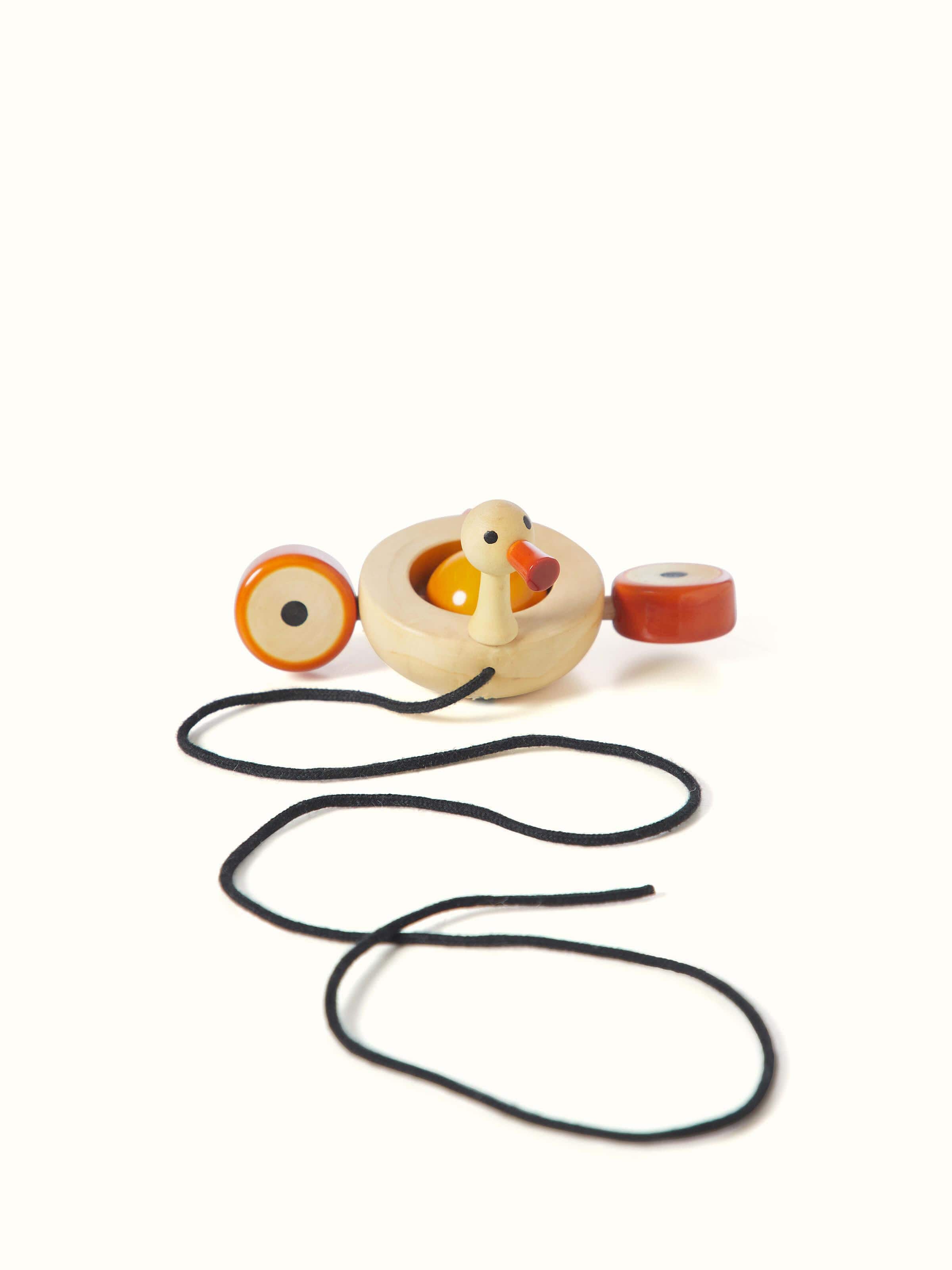 Front view of Channapatna Ivory Wood Duby Duck Toy in off-white, highlighting the smooth finish and design