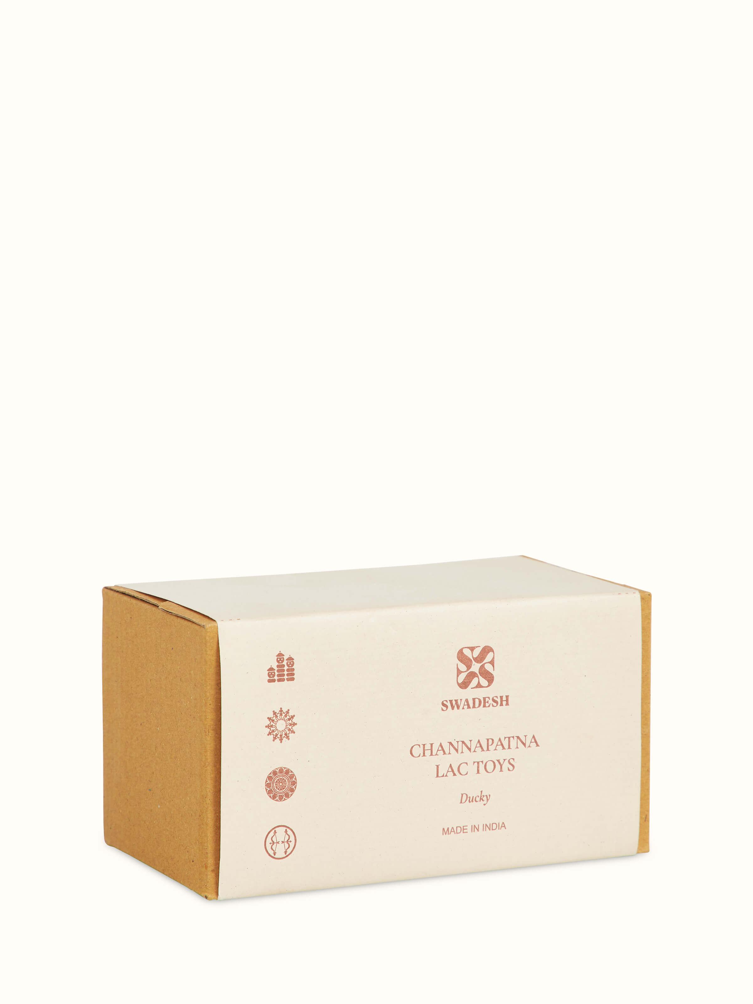 Angled view of Channapatna Ivory Wood Duby Duck Toy, emphasizing the elegant design and craftsmanship