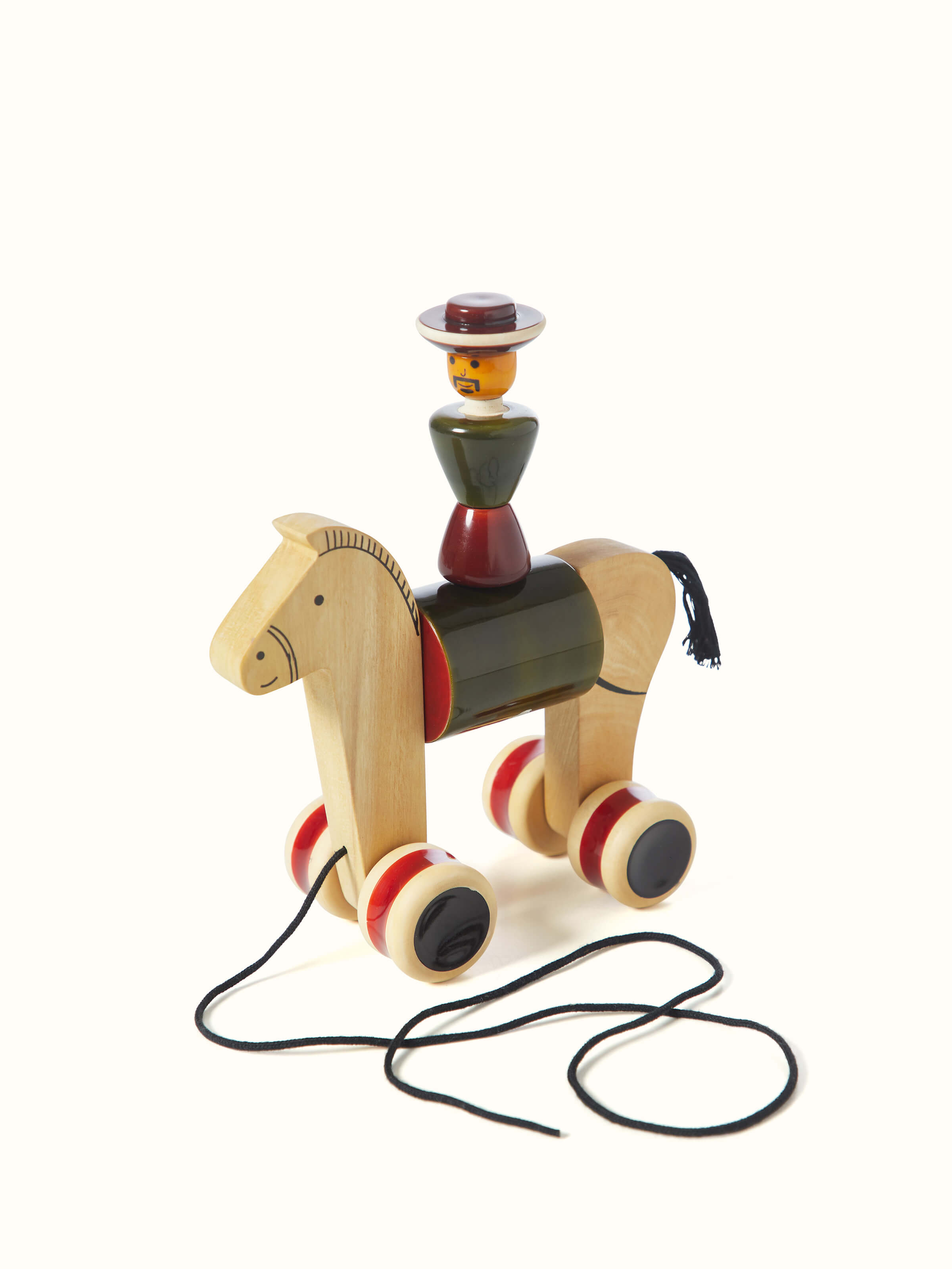 Front view of Channapatna Ivory Wood Man Rider Toy Green featuring a traditional wooden design and green accents.