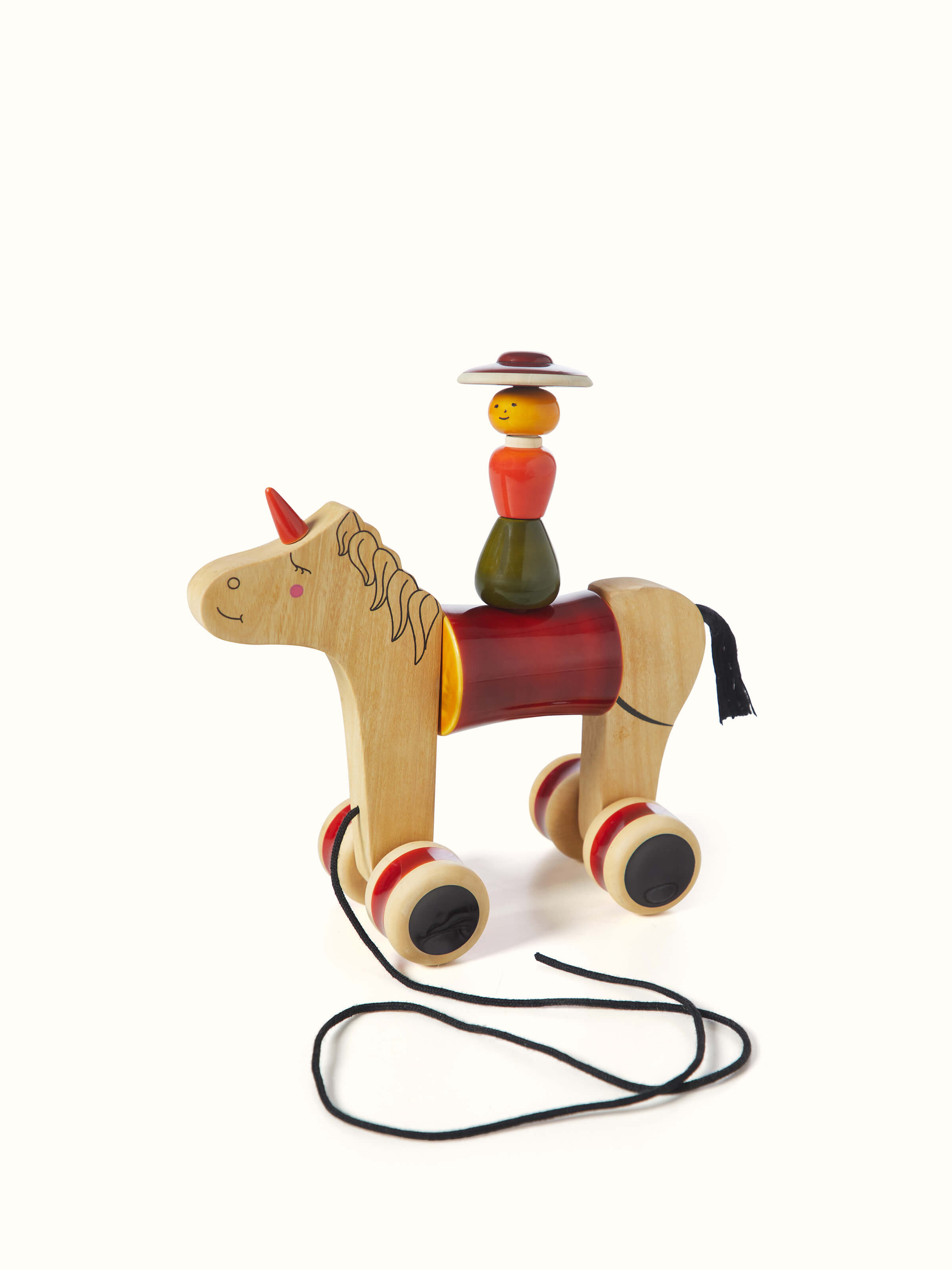 Front view of Channapatna Ivory Wood Woman Rider Hee Haw in red highlighting the traditional wooden craftsmanship and vibrant color.