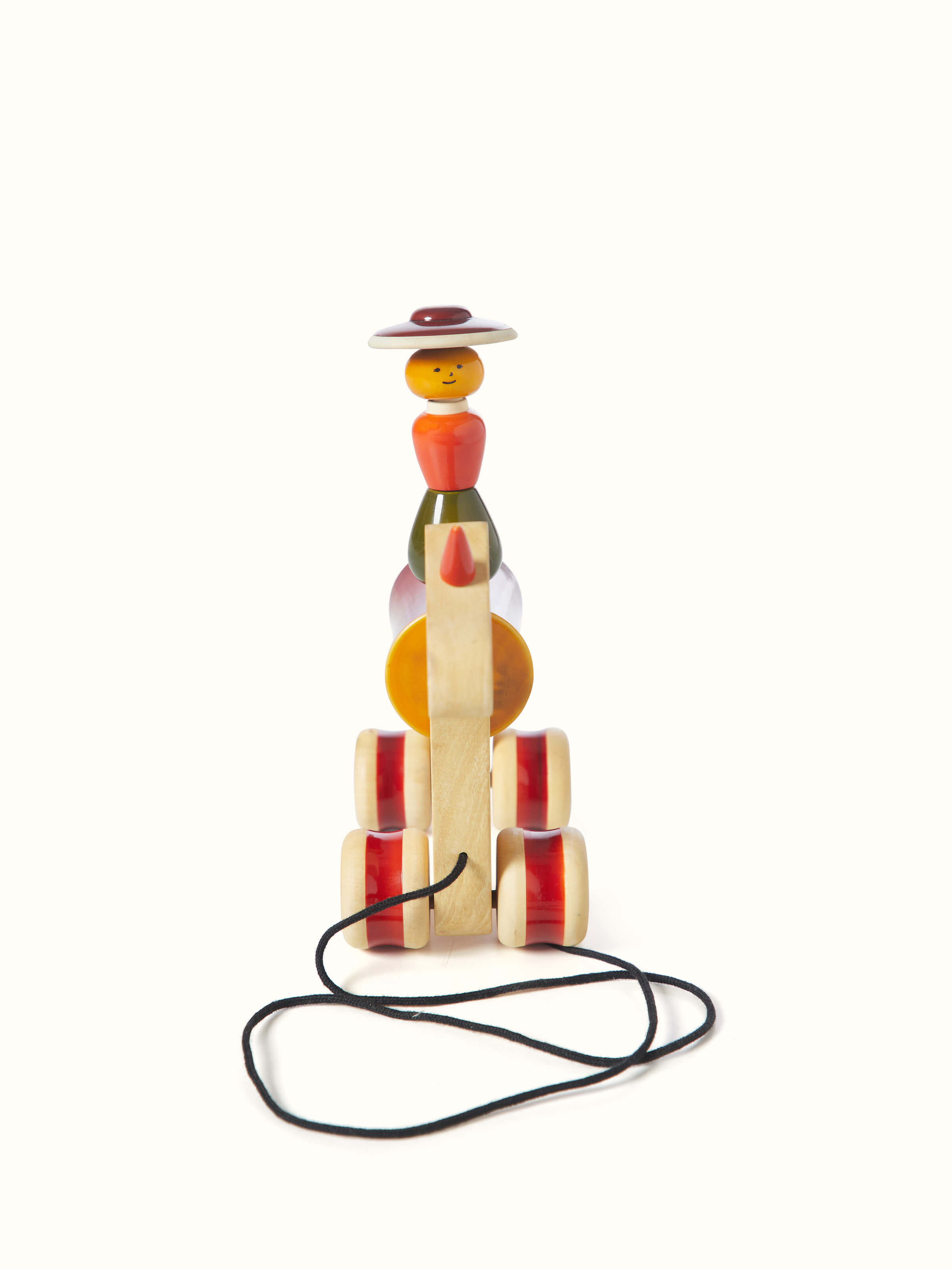 Back view of Channapatna Ivory Wood Woman Rider Hee Haw in red showcasing the back craftsmanship and painting details.