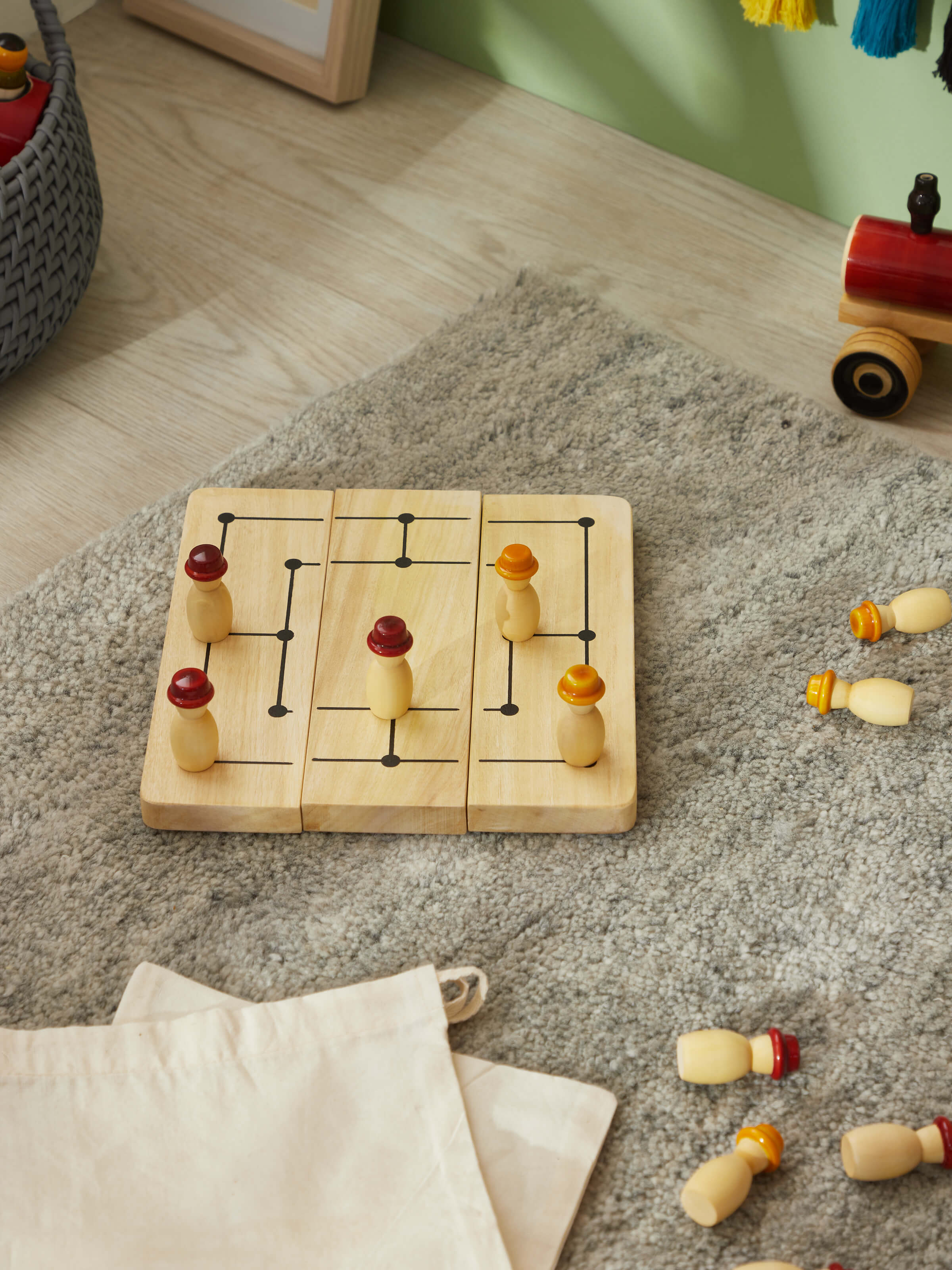 Angle view of Channapatna ivory wood six men's morris off-white