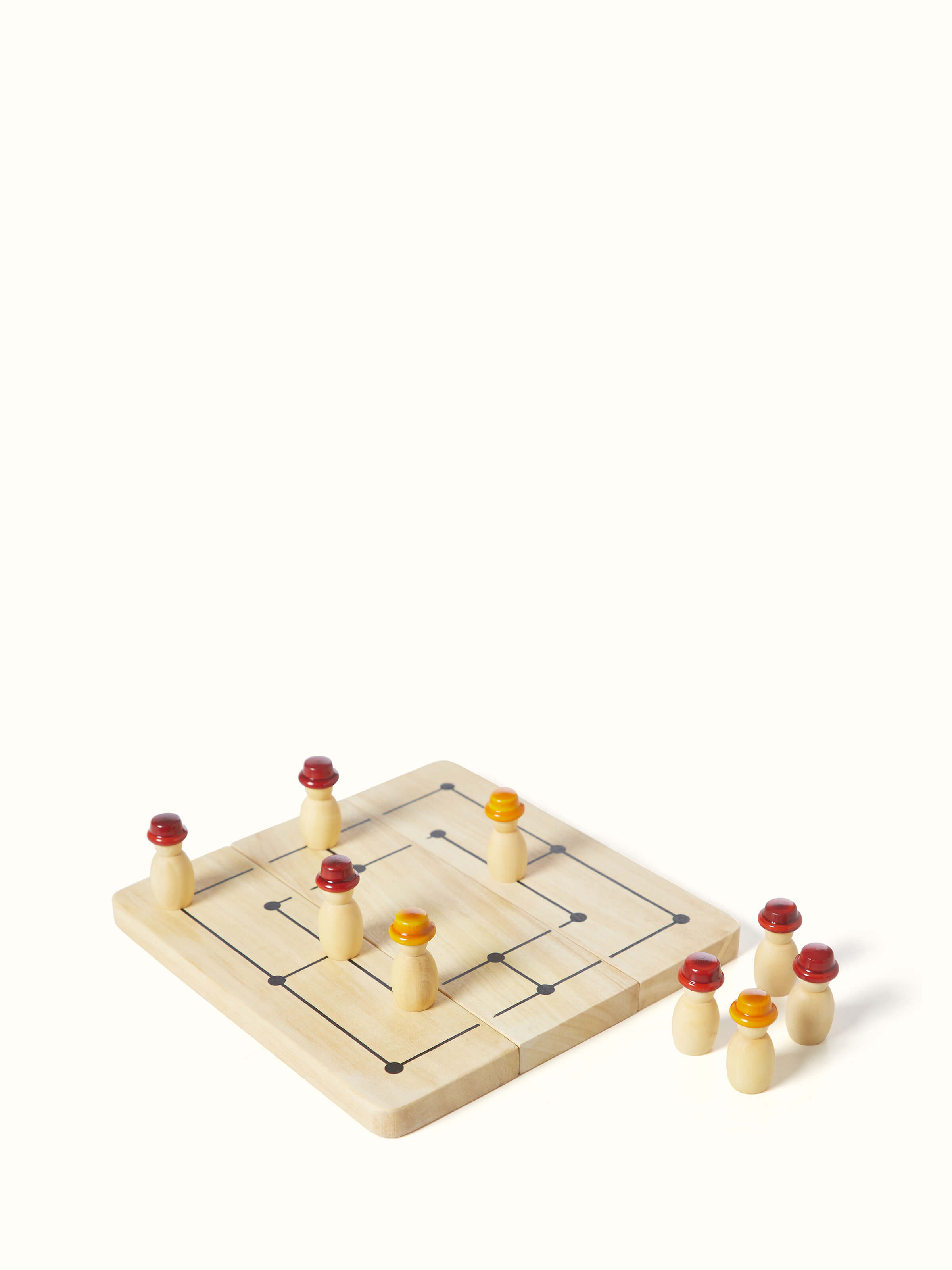 Close-up view of Channapatna ivory wood six men's morris off-white