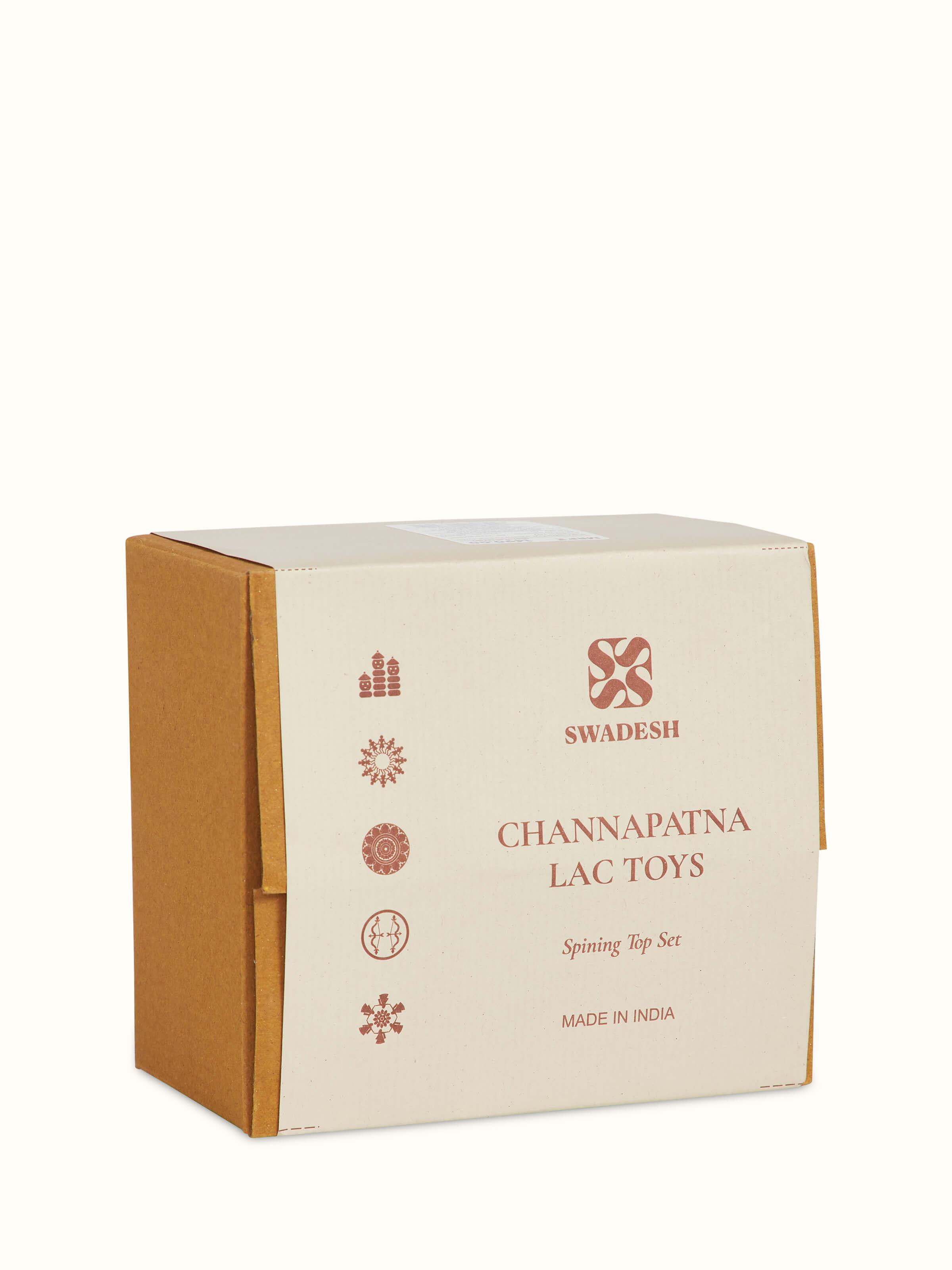 Close-up of Channapatna ivory wood merry top showing its traditional design and craftsmanship.