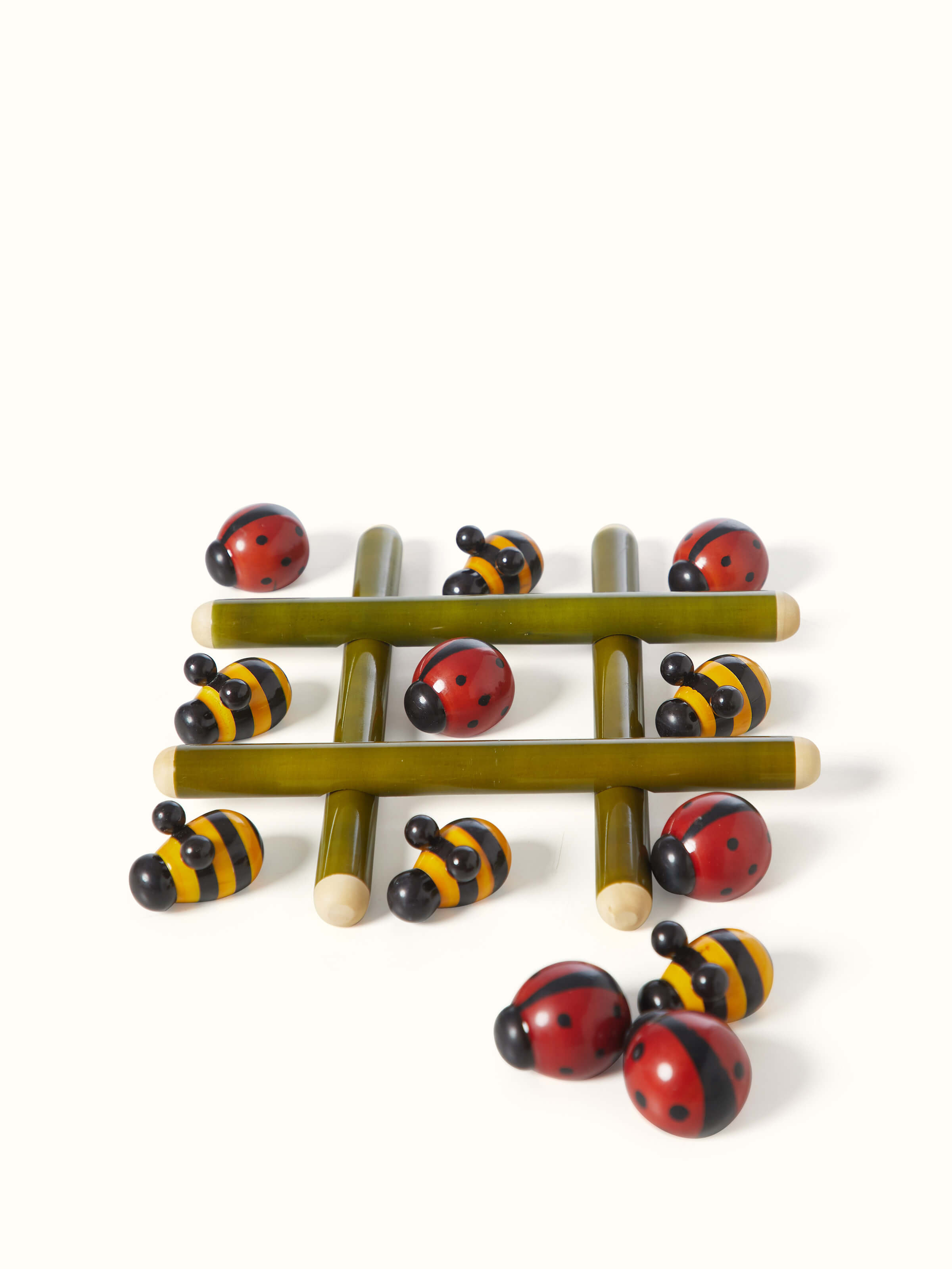 Front view of Channapatna ivory wood tic-tac-toe game showcasing handcrafted design and smooth finish