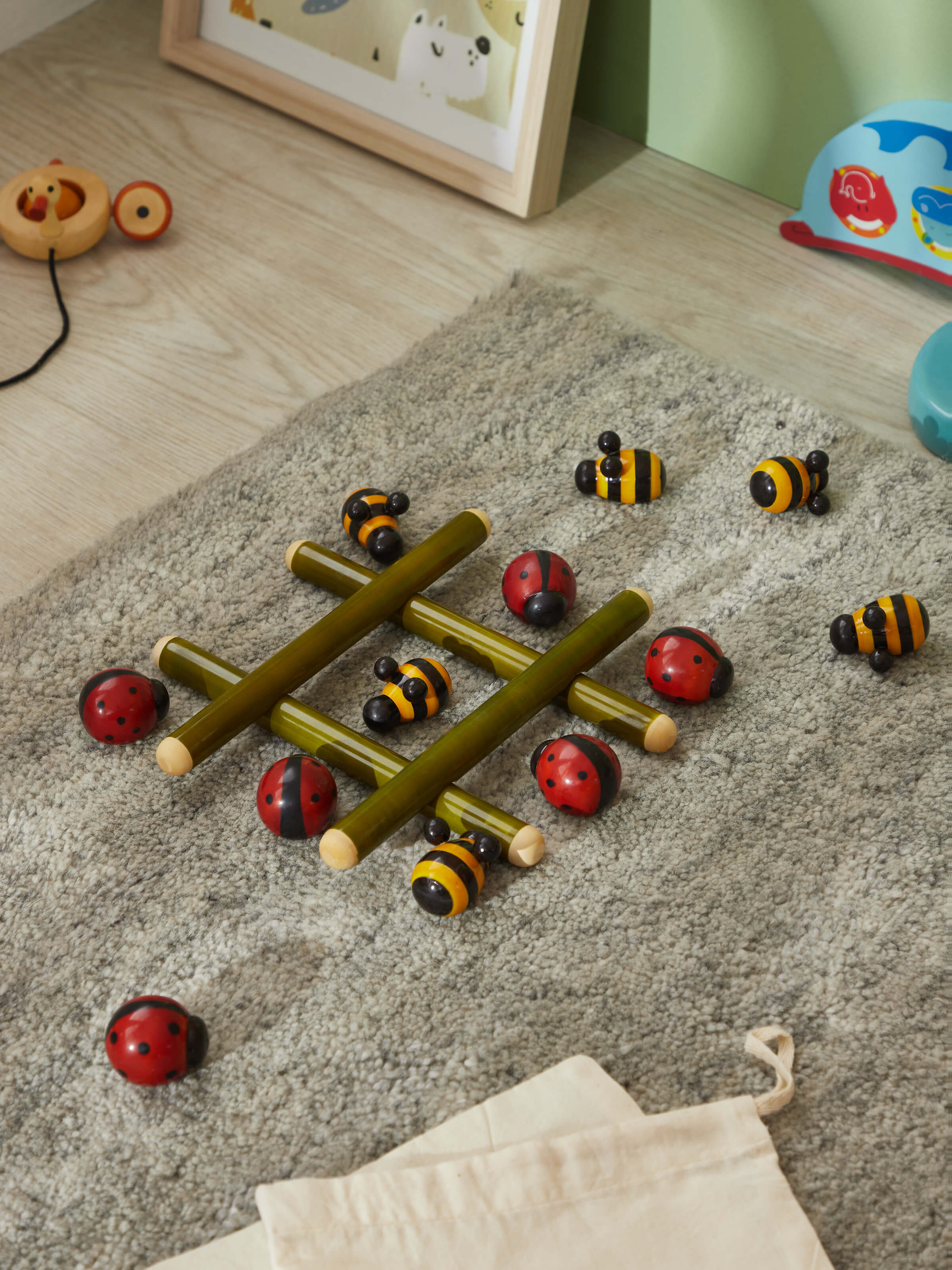 Side view of Channapatna ivory wood tic-tac-toe game highlighting its elegant side profile and craftsmanship