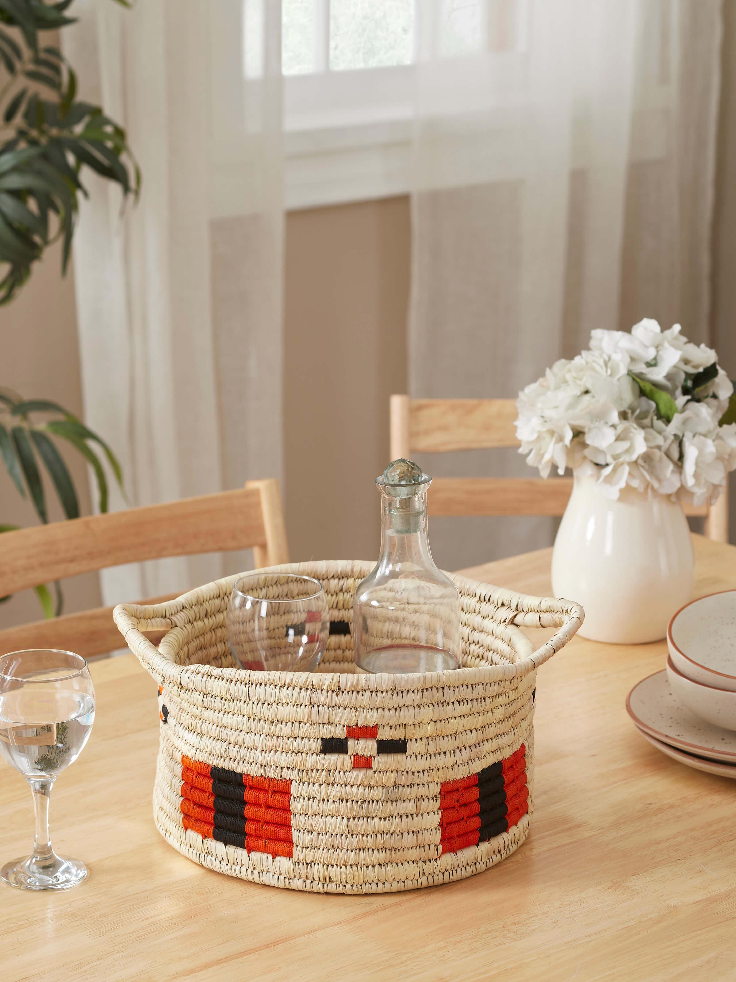 Side view of Kanshi basketry natural fibre wine bottle holder highlighting its craftsmanship