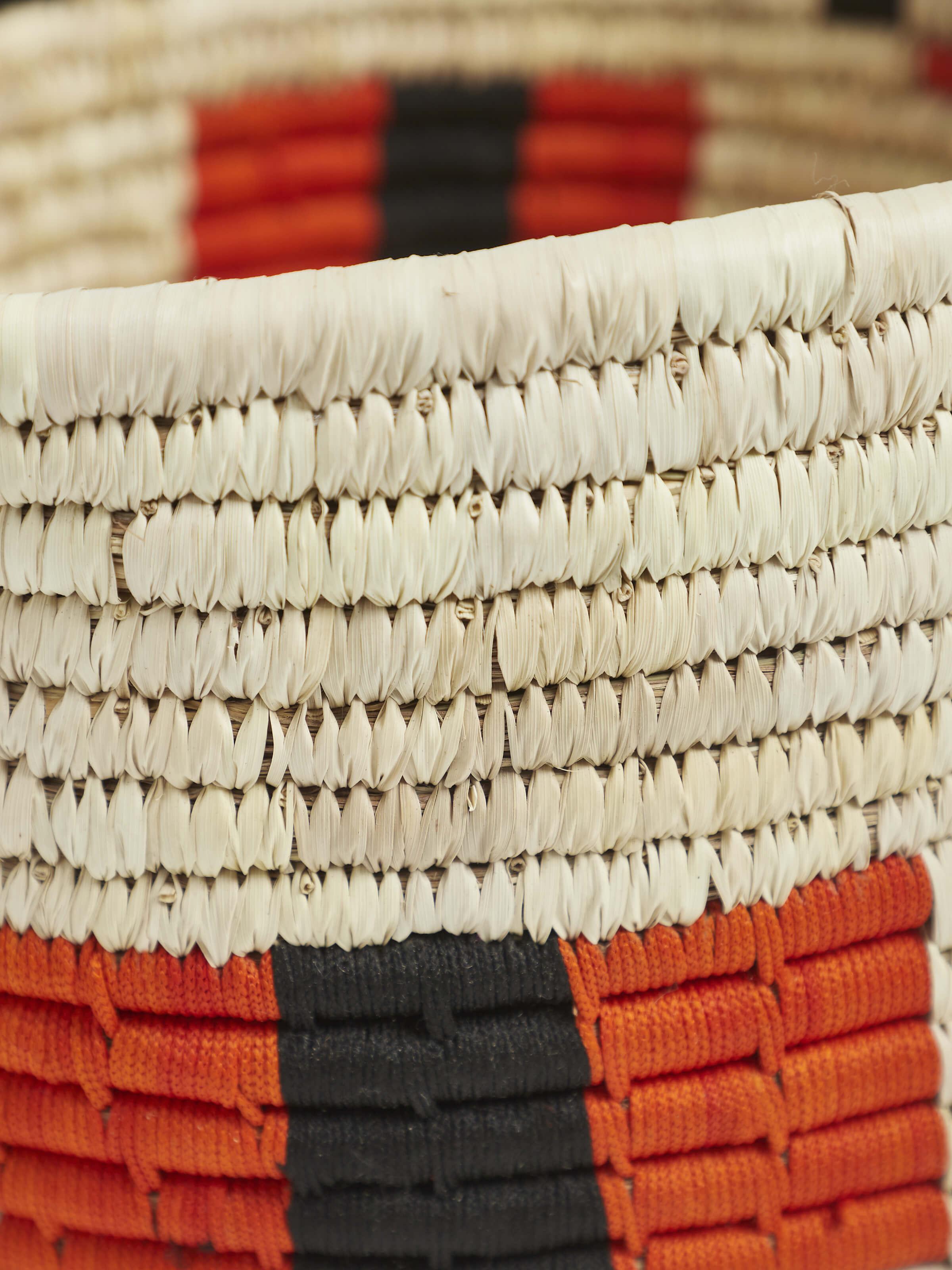 Close-up of Kanshi basketry natural fibre wine bottle holder emphasizing weaving details