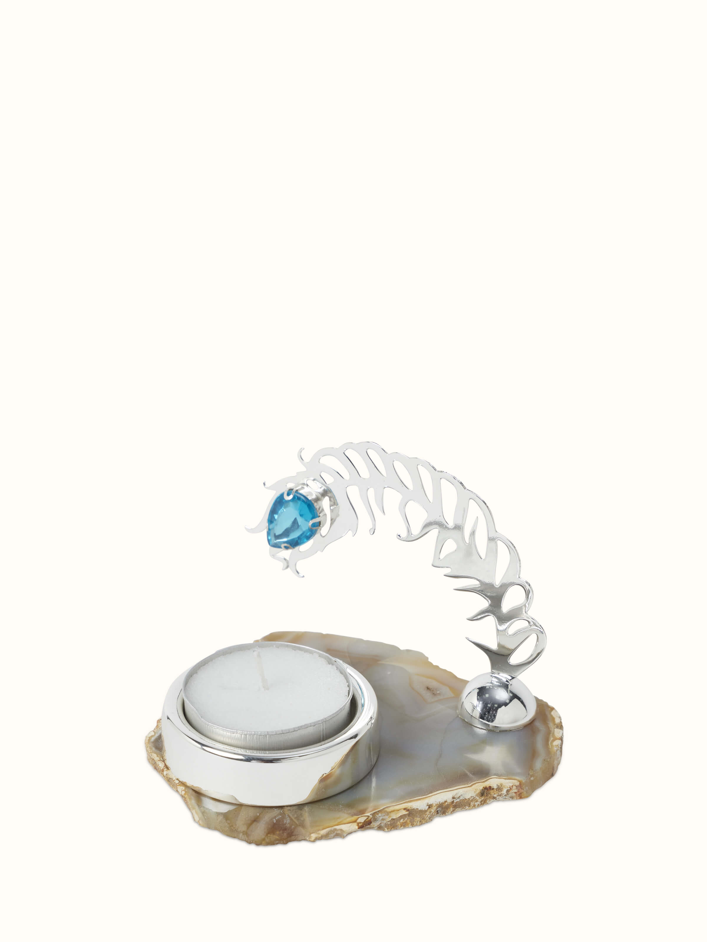 Front view of Silver-plated peacock feather tea light holder featuring a blue gemstone accent