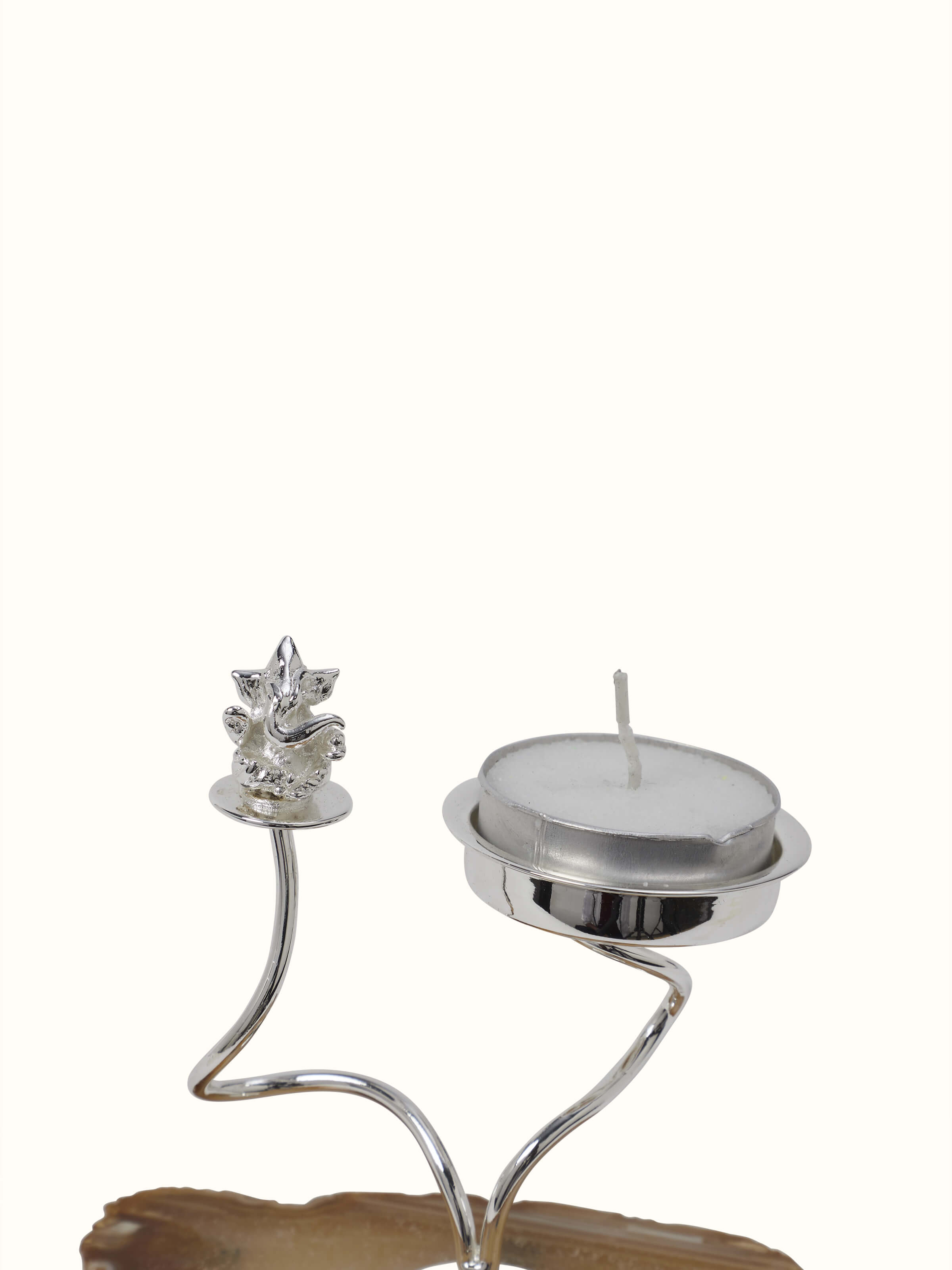 Front view of Silver-plated Ganesha tea light holder showcasing its intricate design and reflective finish.
