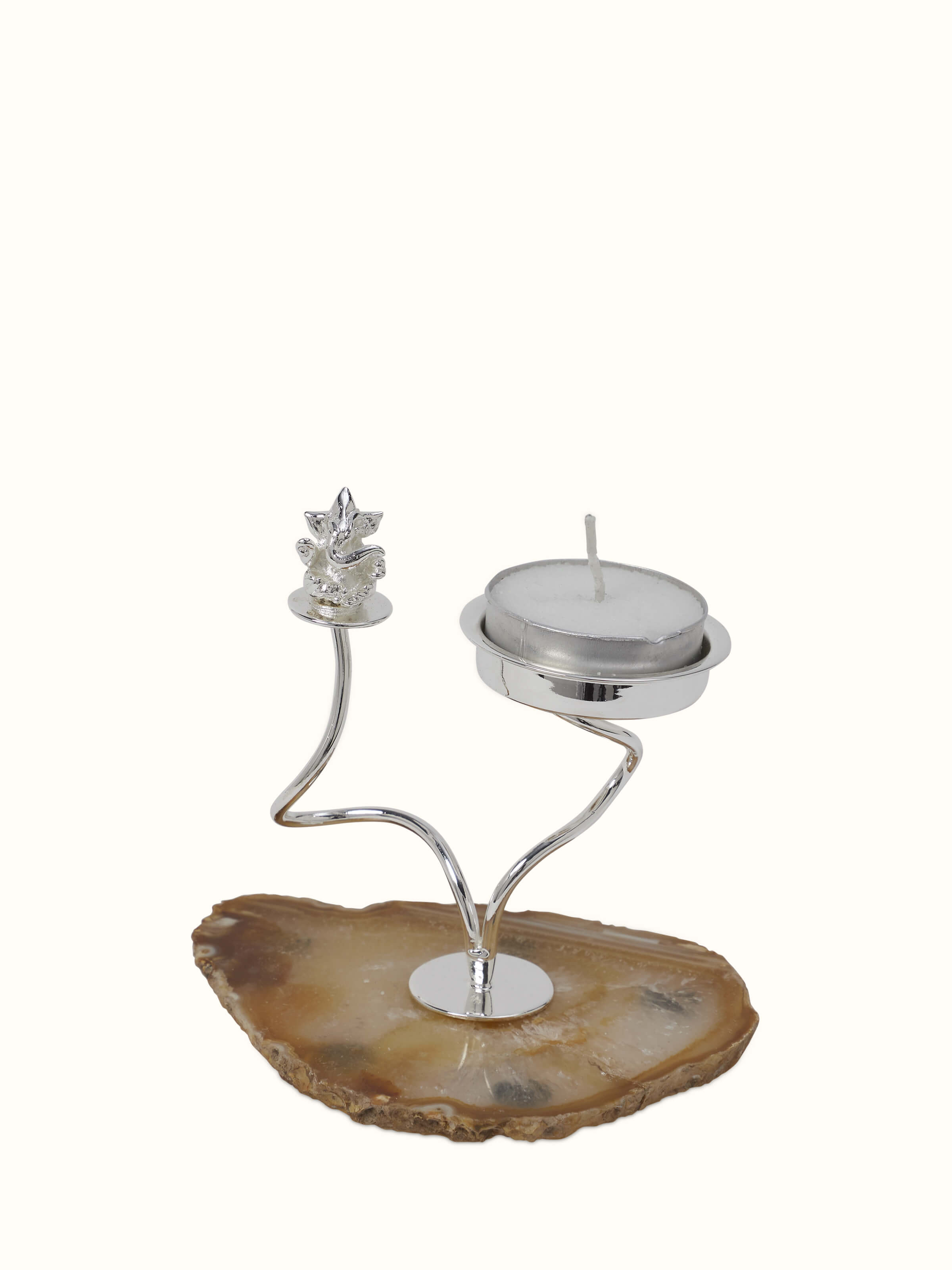 Side view of Silver-plated Ganesha tea light holder highlighting its detailed craftsmanship and elegant shape.