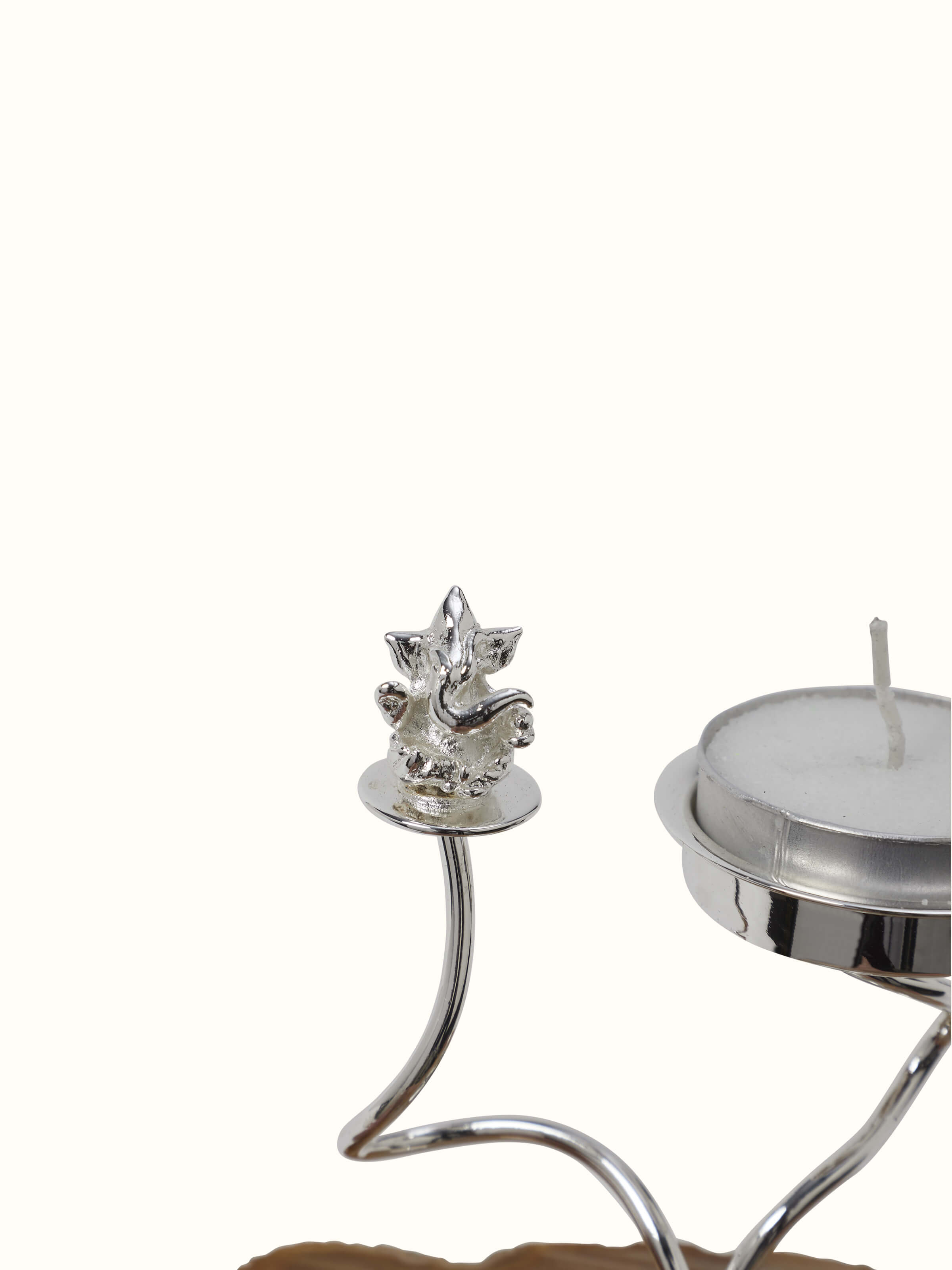 Close-up view of Silver-plated Ganesha tea light holder focusing on the ornate detailing and polished surface.