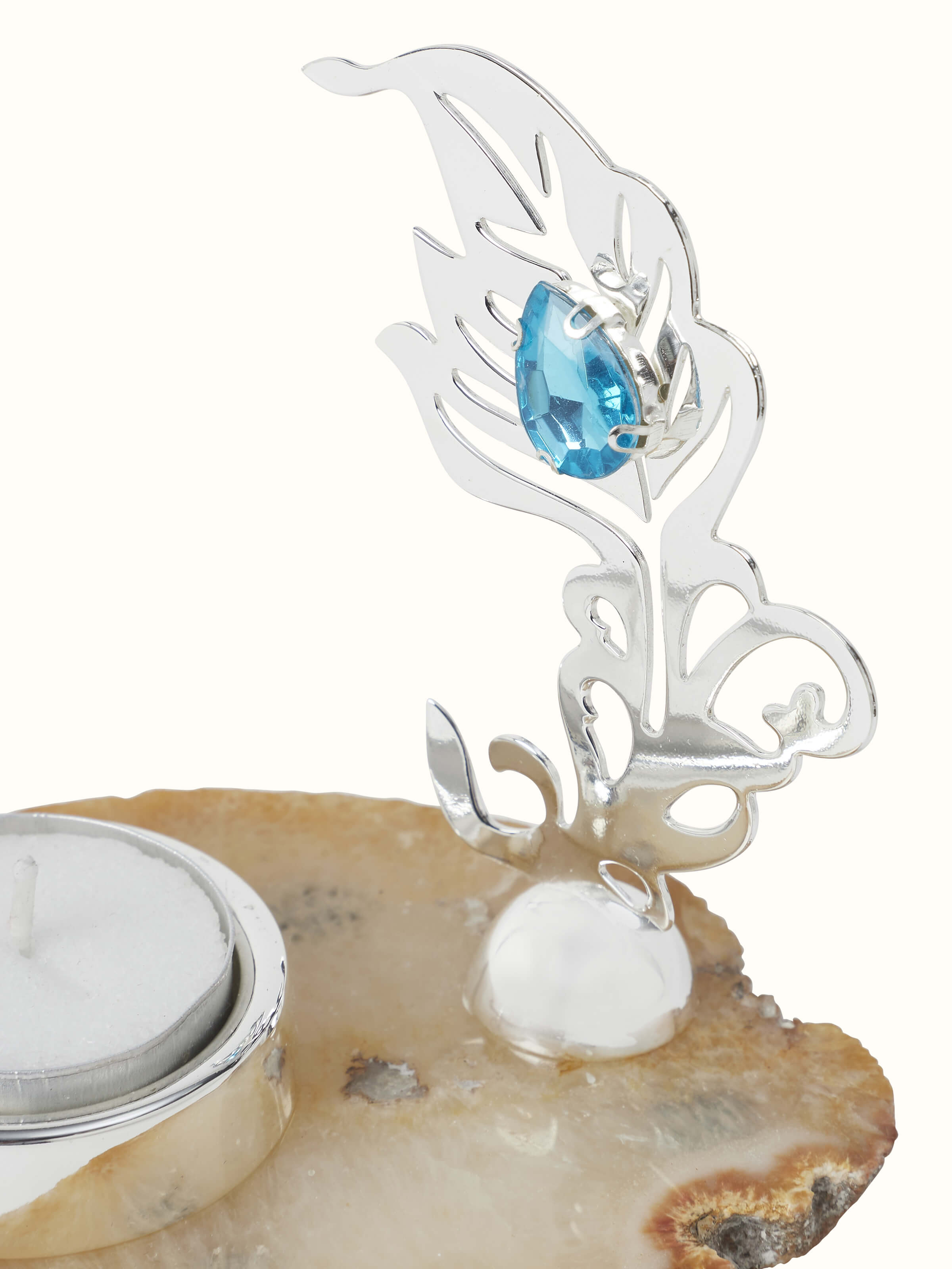 Close-up view of the silver-plated feather tea light holder, showing detailed feather texture and shine.