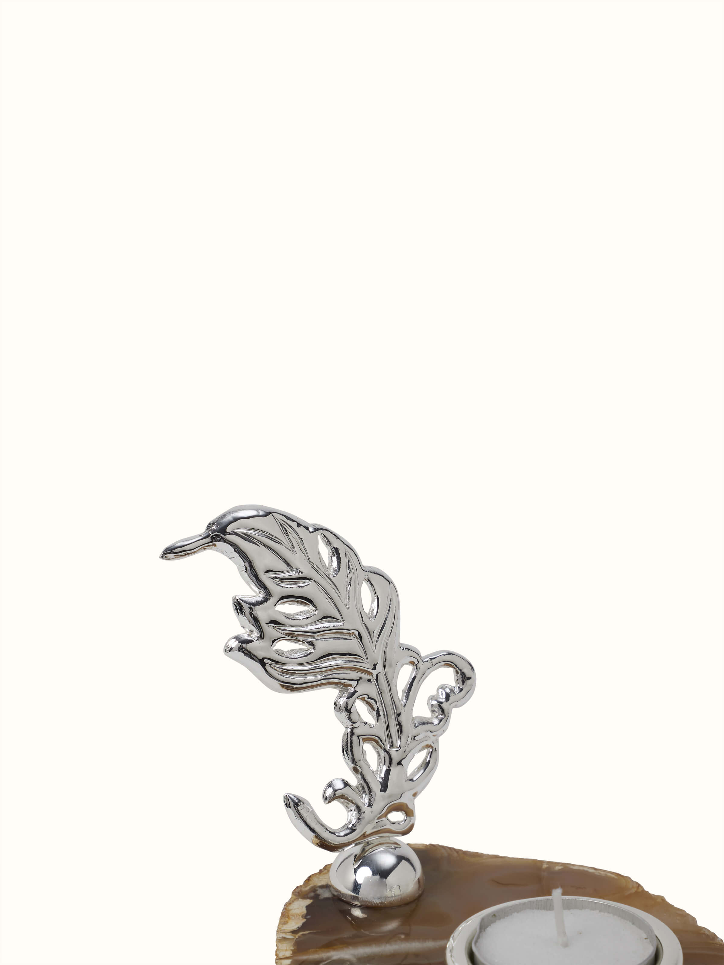 Detailed shot of Silver-Plated Peacock Feather Tea Light Holder highlighting fine craftsmanship