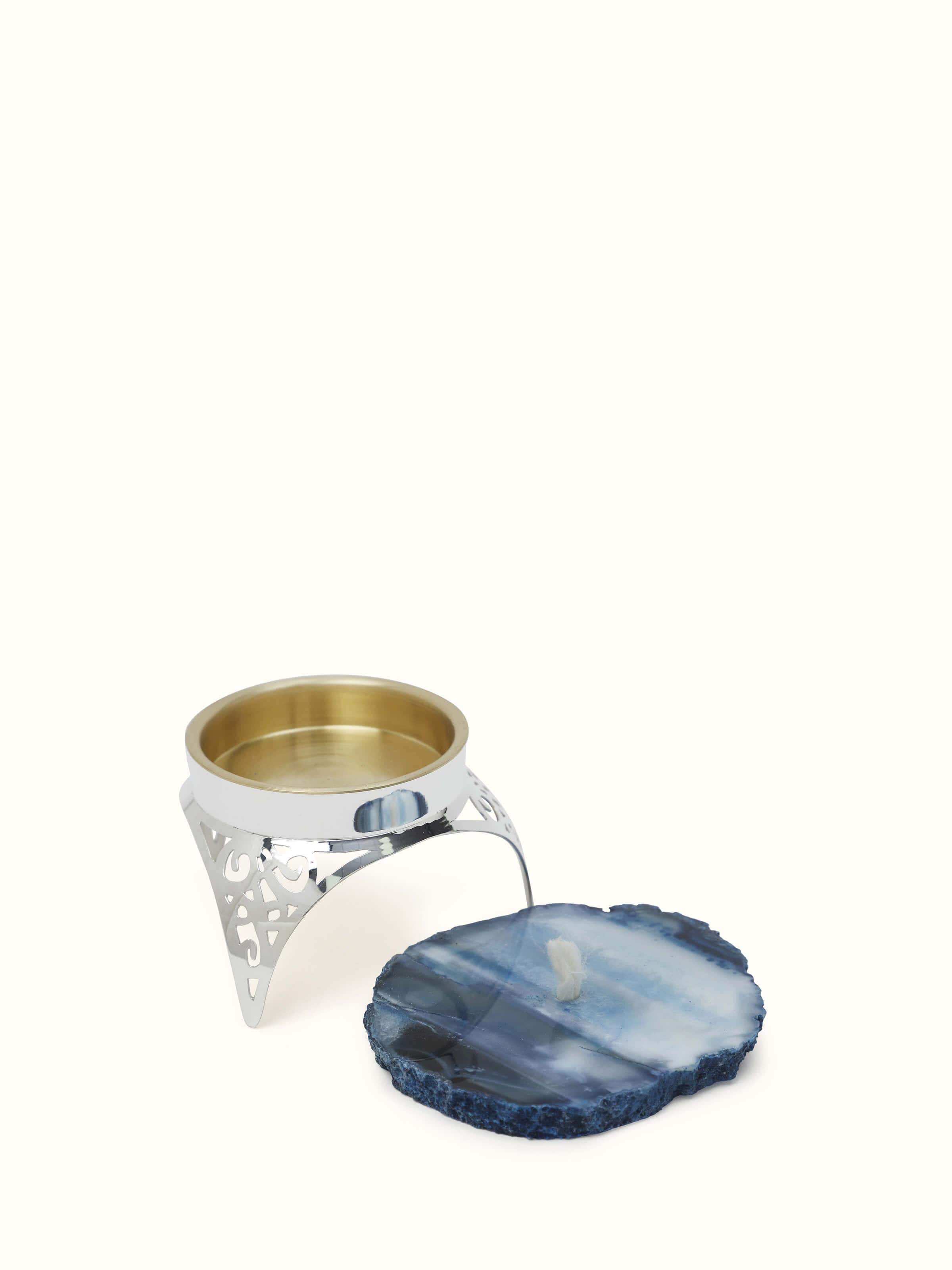 Front view of Silver & onyx diya showcasing its classic design and luxurious materials