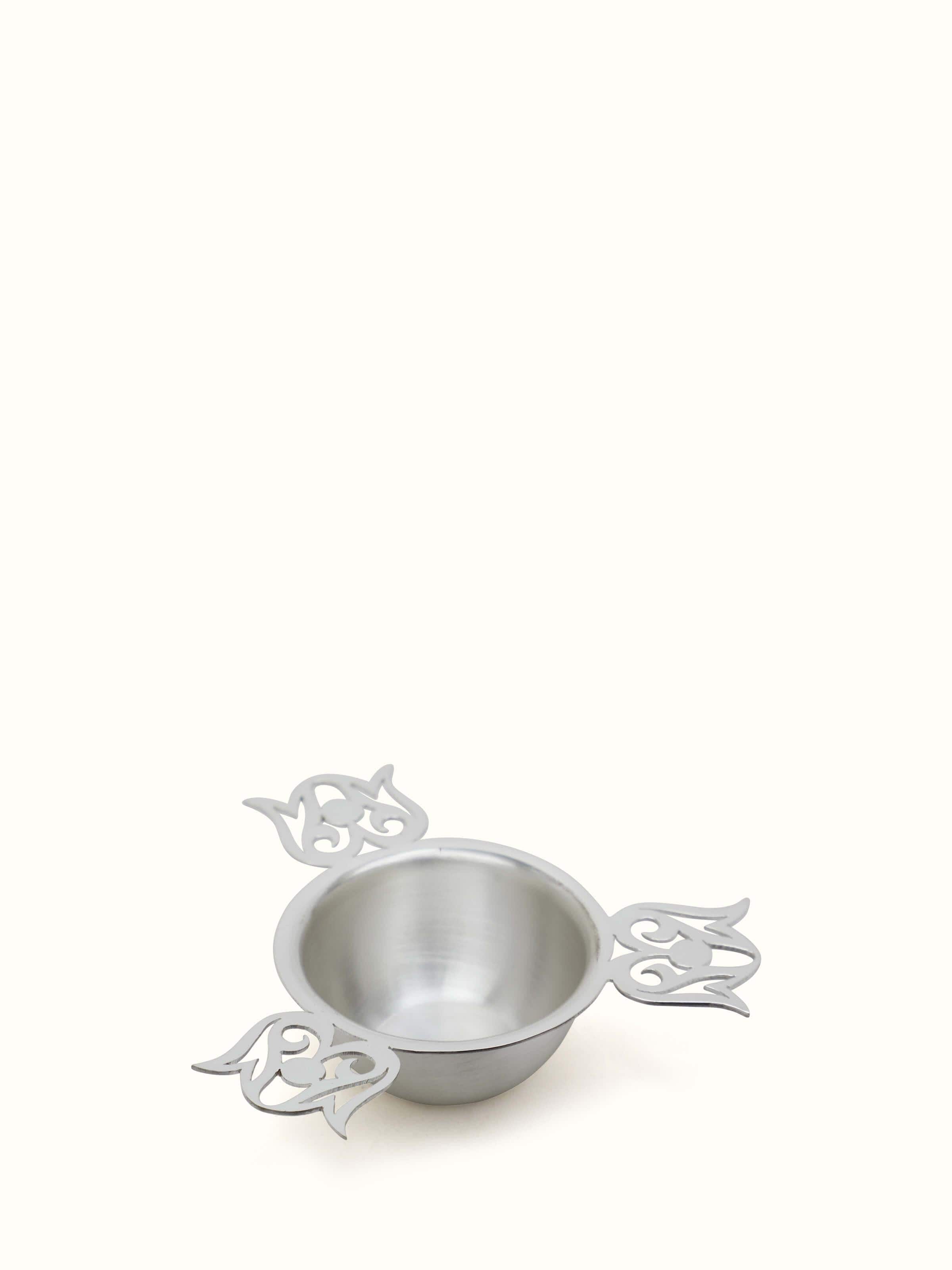 Close-up of Silver Cut Work Diya, highlighting the detailed craftsmanship and shine