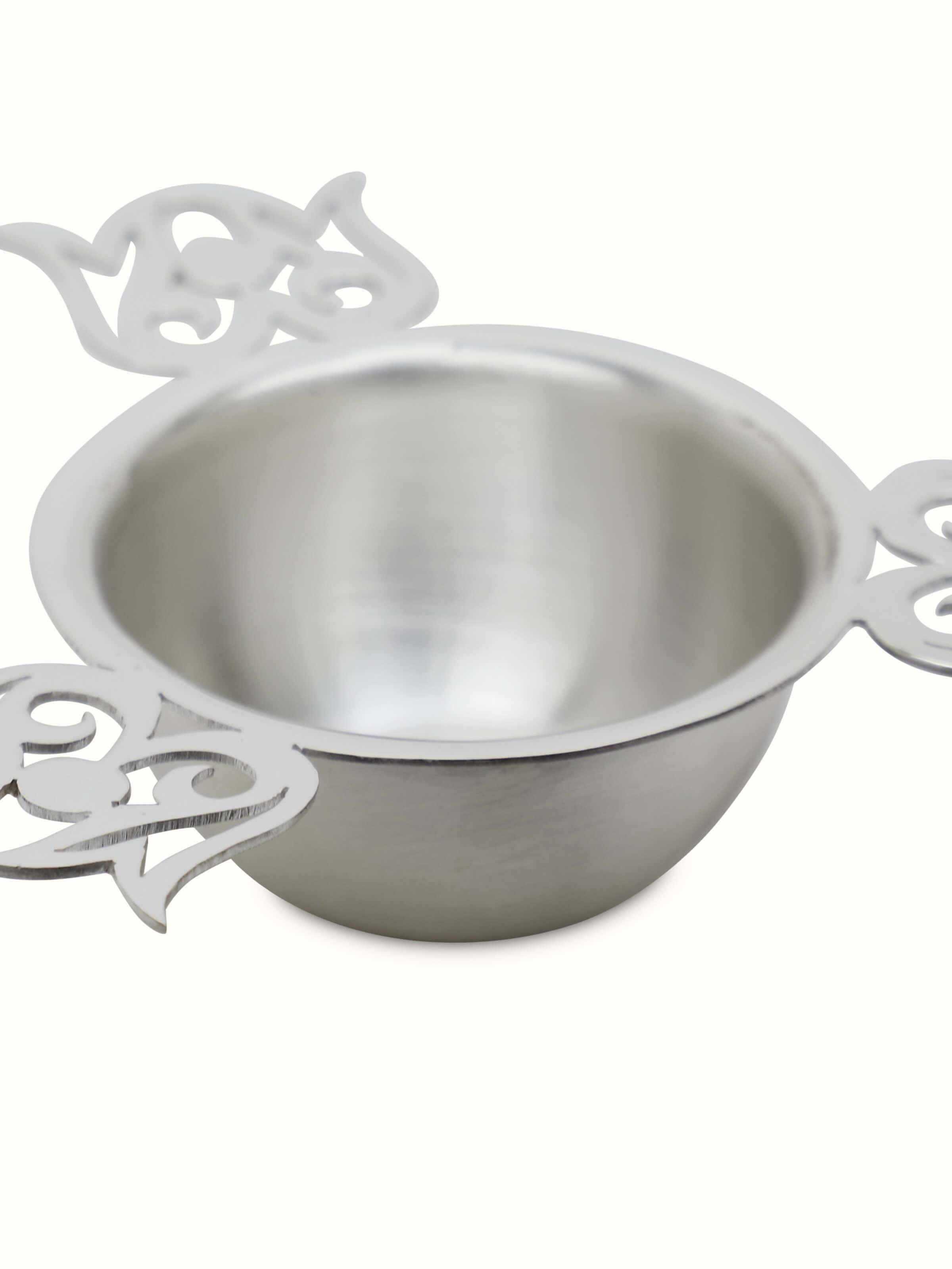 Side view of Silver Cut Work Diya, displaying the depth and intricate patterns of the design