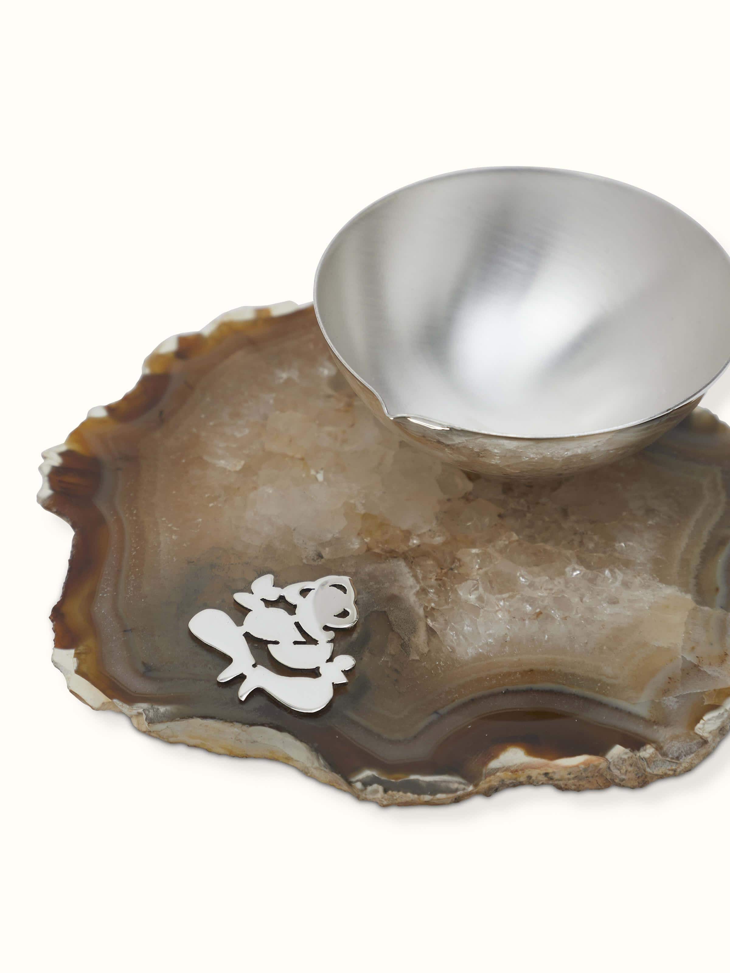 Side view of Silver Ganesh diya showcasing detailed craftsmanship and design