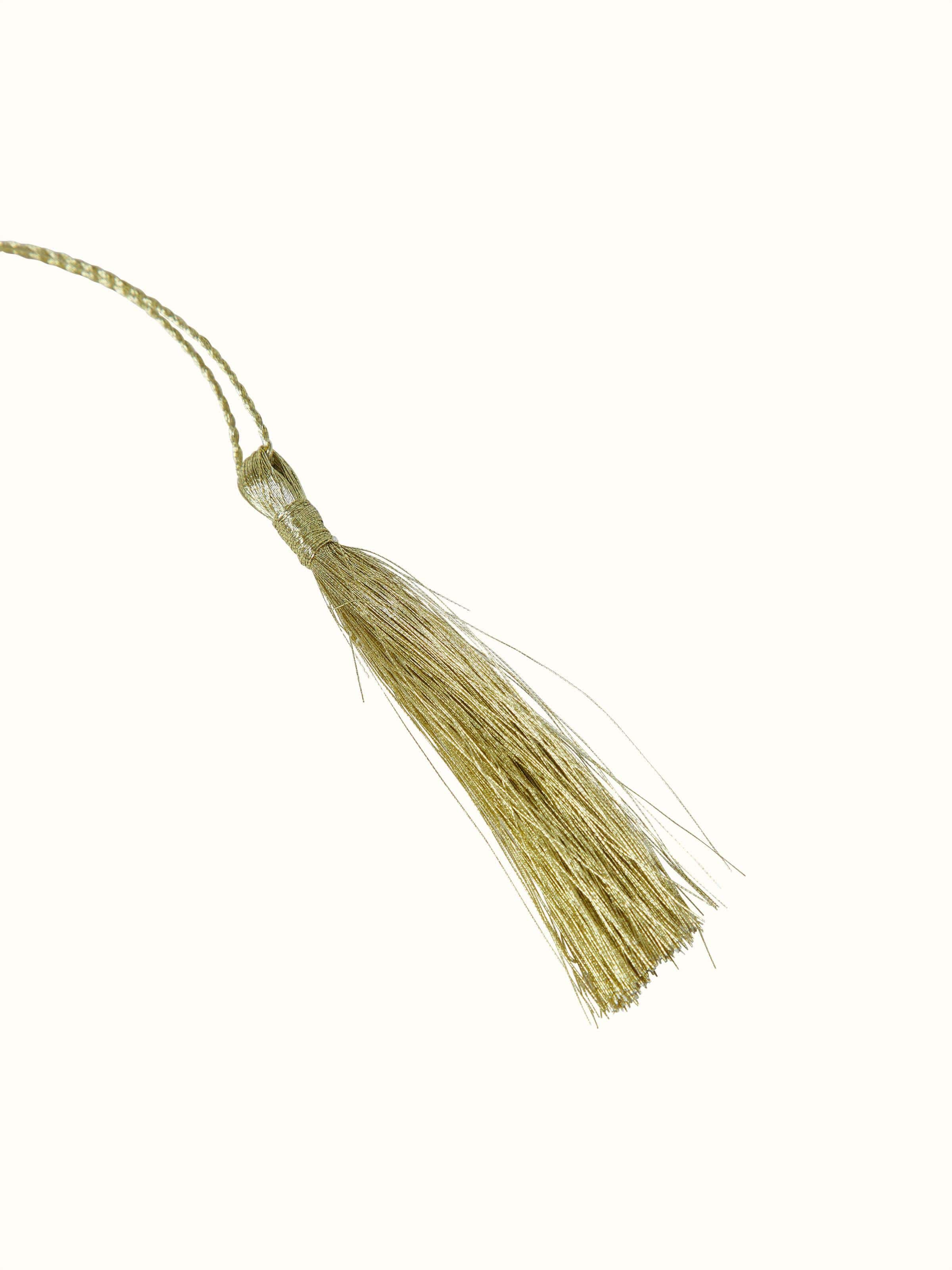 Detailed view of silver-plated paisley bookmark showcasing intricate design.