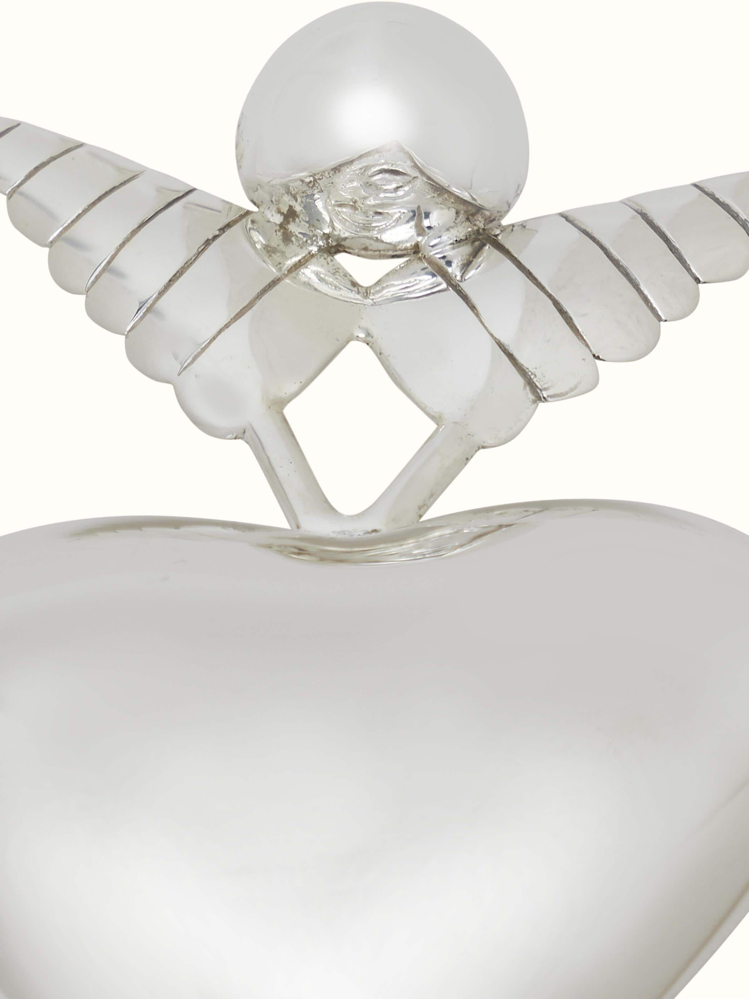 Side view of Silver Angel Rattle Toy highlighting its detailed craftsmanship and angelic form.