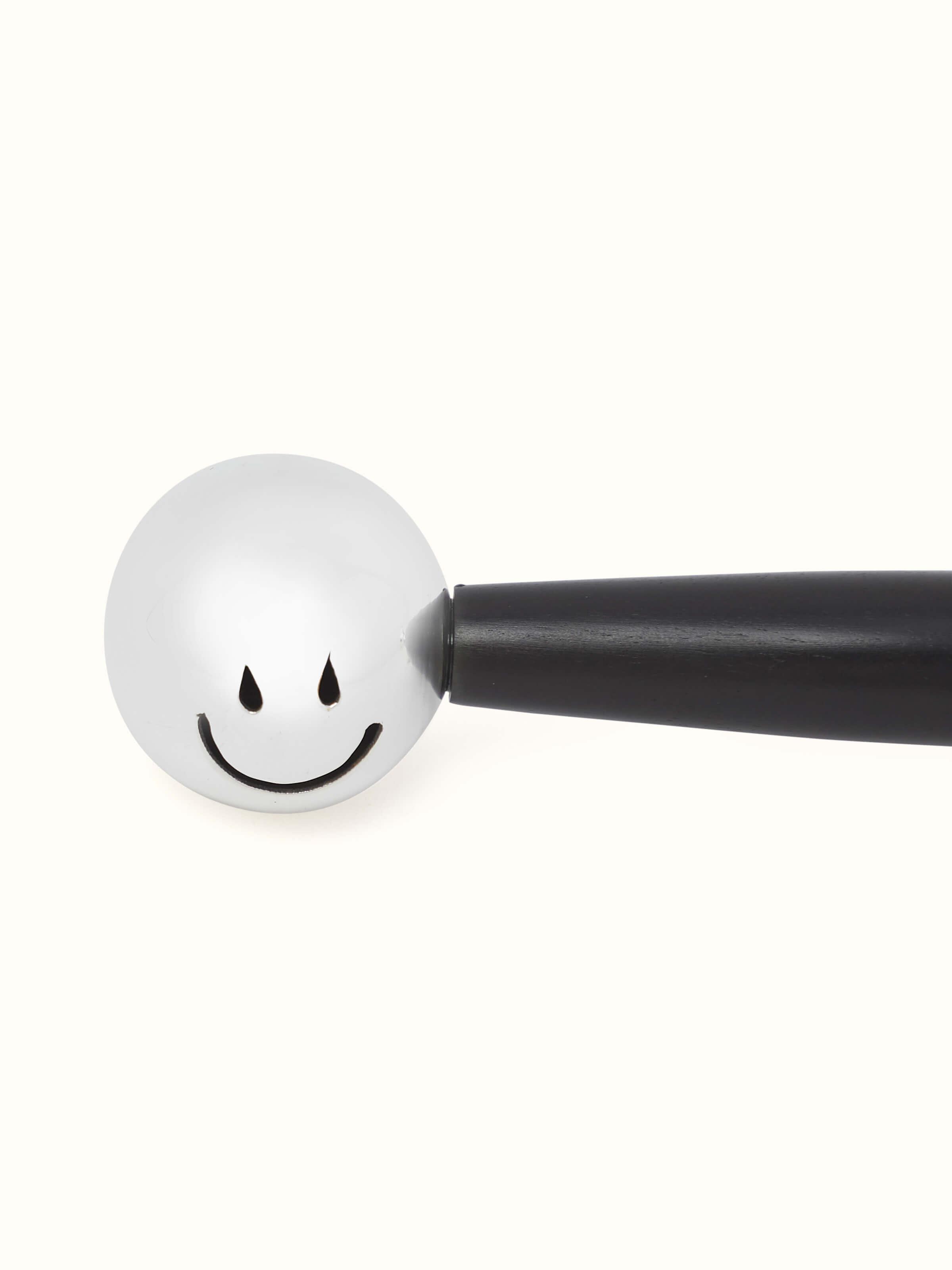Close-up of Silver Dumbbell Rattle Toy focusing on the detailed metalwork and texture.