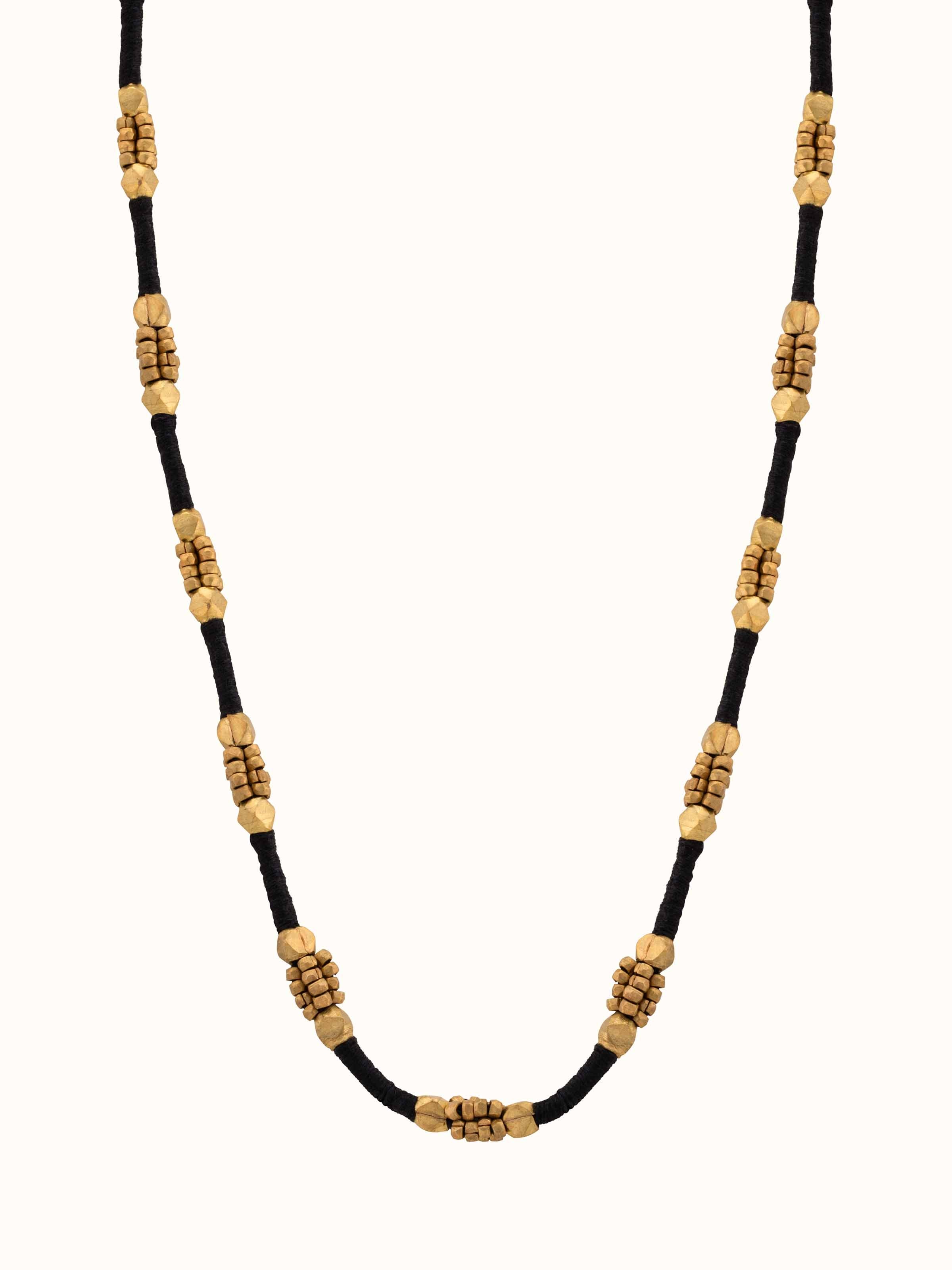 Front view of Dhokra long necklace featuring traditional metalwork