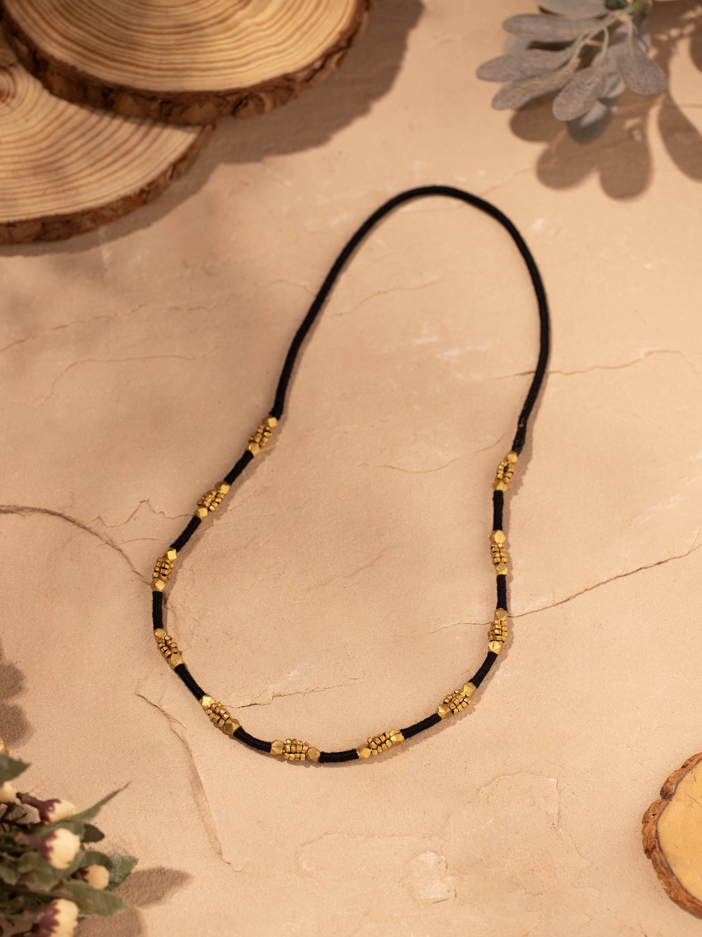 Side view of Dhokra long necklace emphasizing intricate craftsmanship