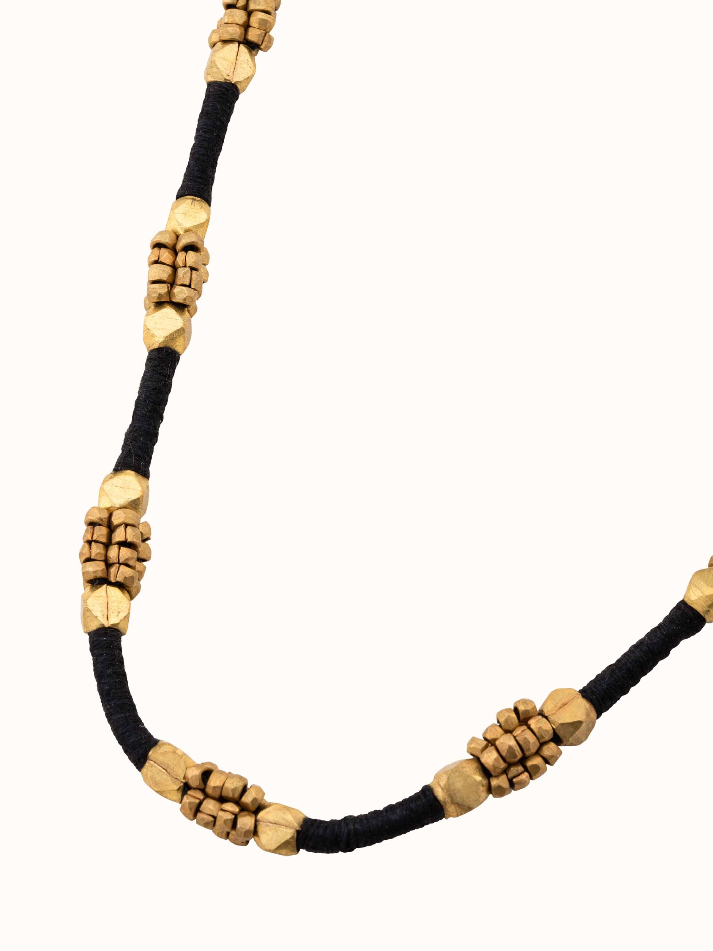 Detailed shot of Dhokra long necklace with traditional design elements