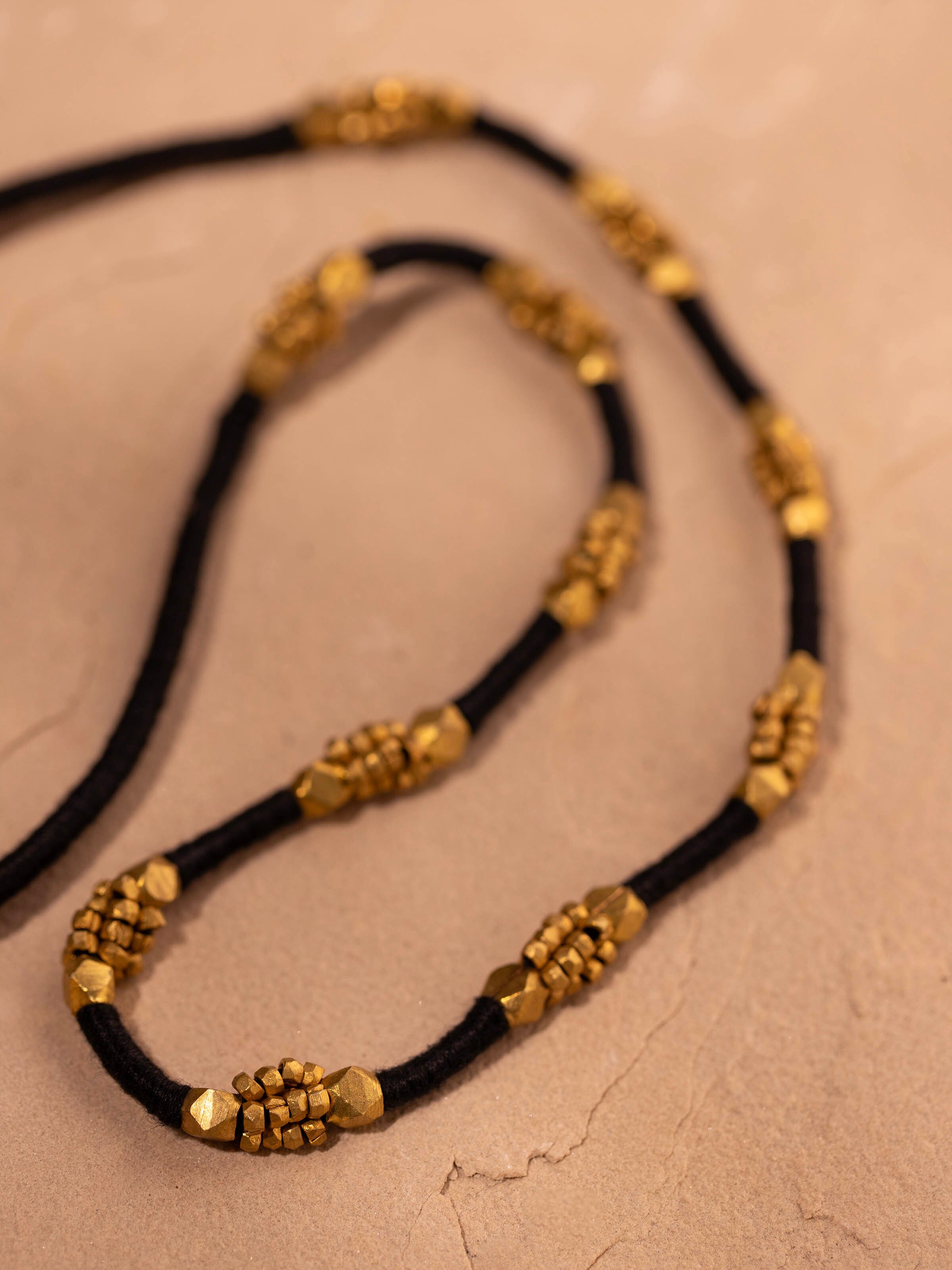 Angled view of Dhokra long necklace highlighting its unique style