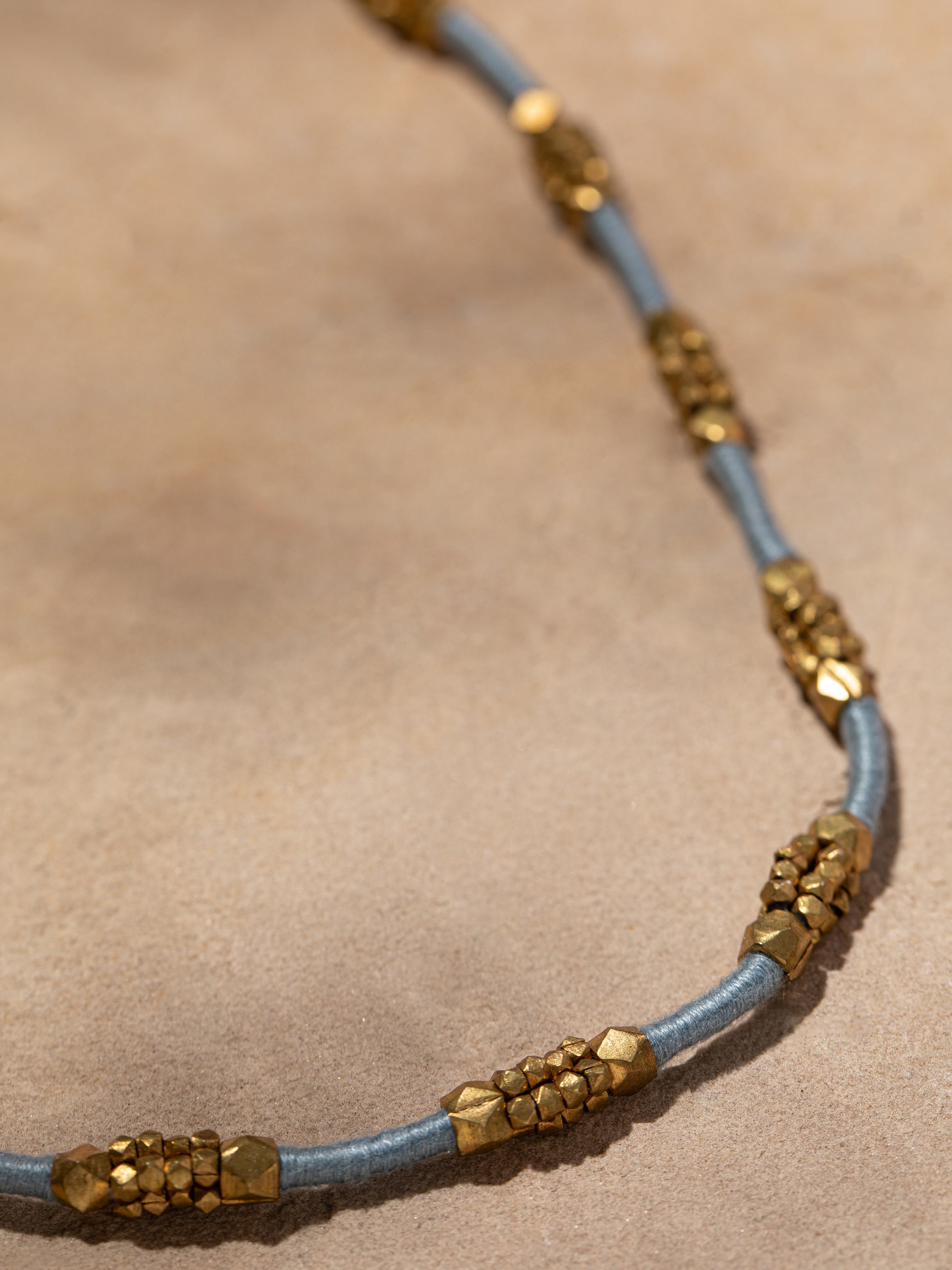 Detailed view of Dhokra Long Necklace focusing on traditional Dhokra patterns and artistry.
