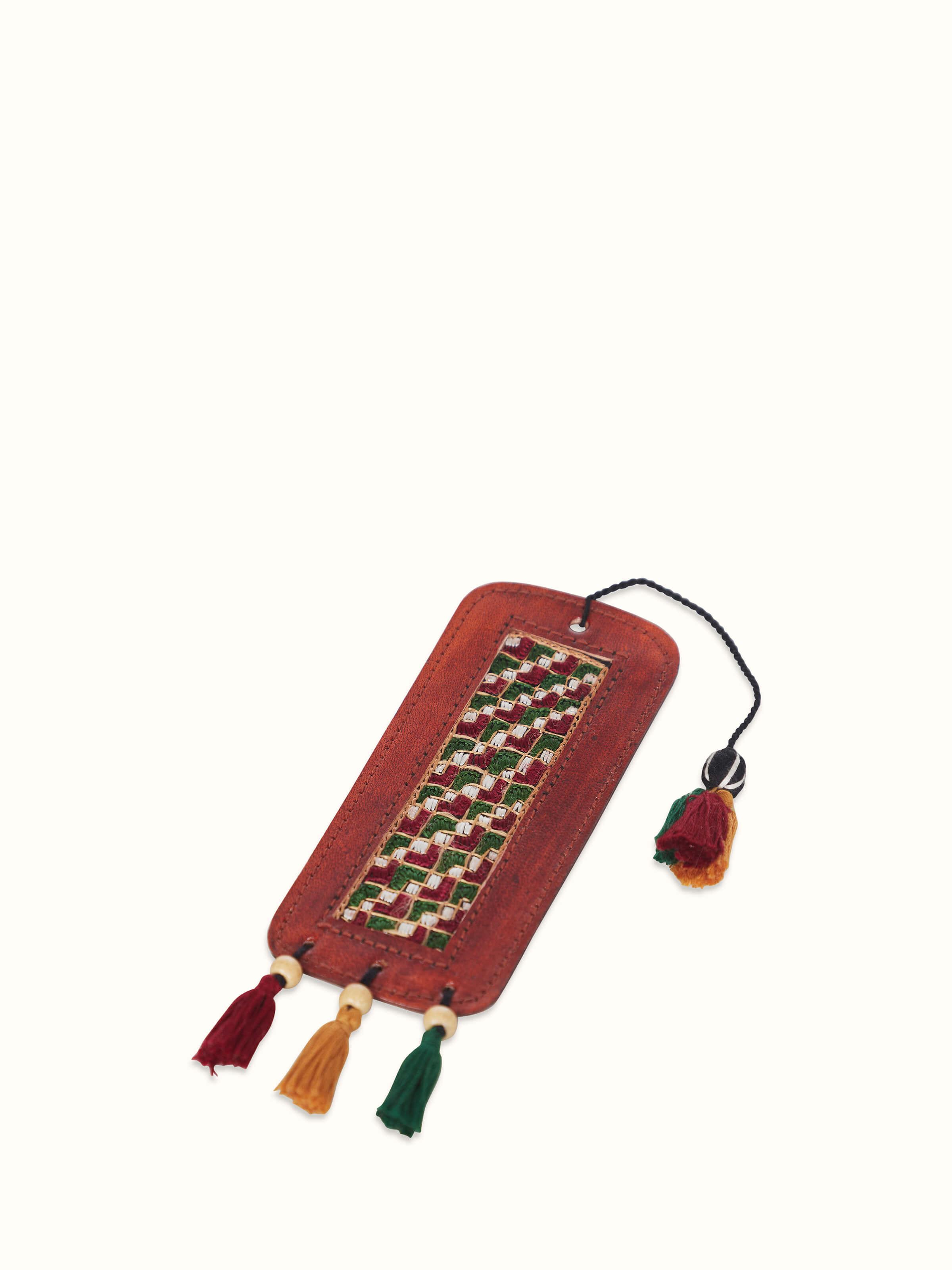 Front view of Kutch embroidery leather bookmark in red, showcasing the intricate embroidery.