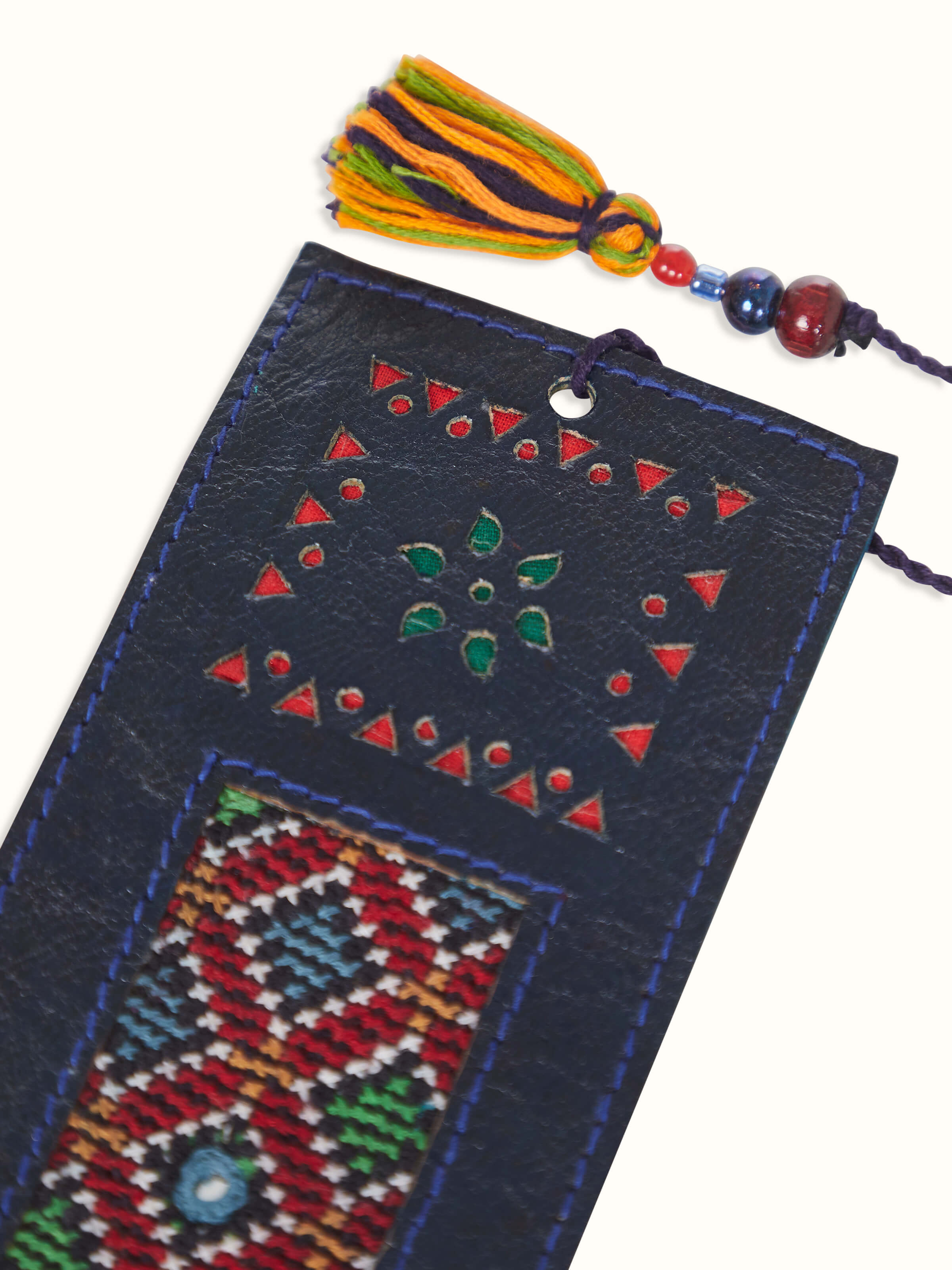 Full view of blue Kutch embroidery leather bookmark, highlighting its elegant design and vibrant color.