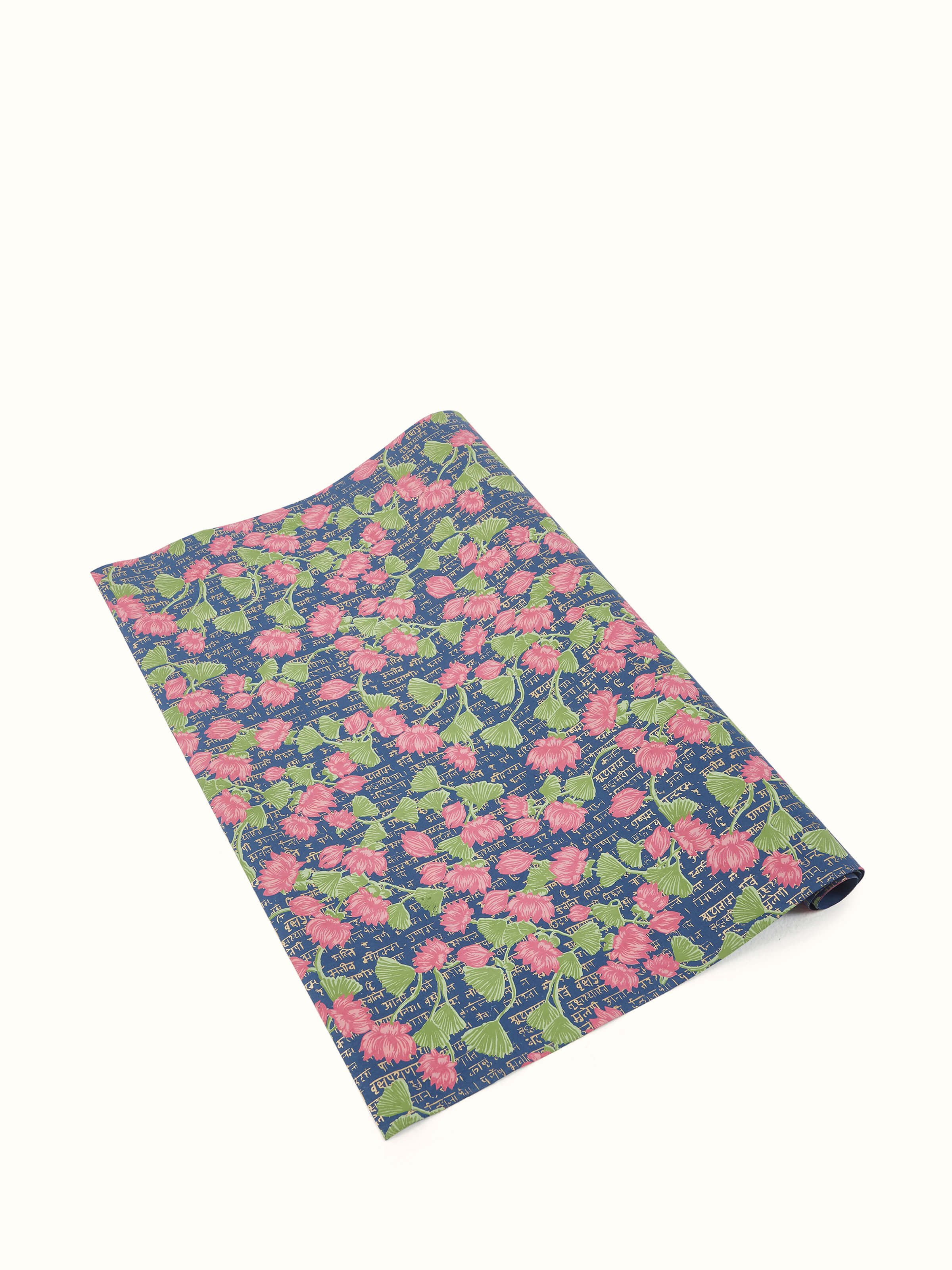 Side view of blue handmade paper wrapping sheets, showing the thickness and texture of the paper.