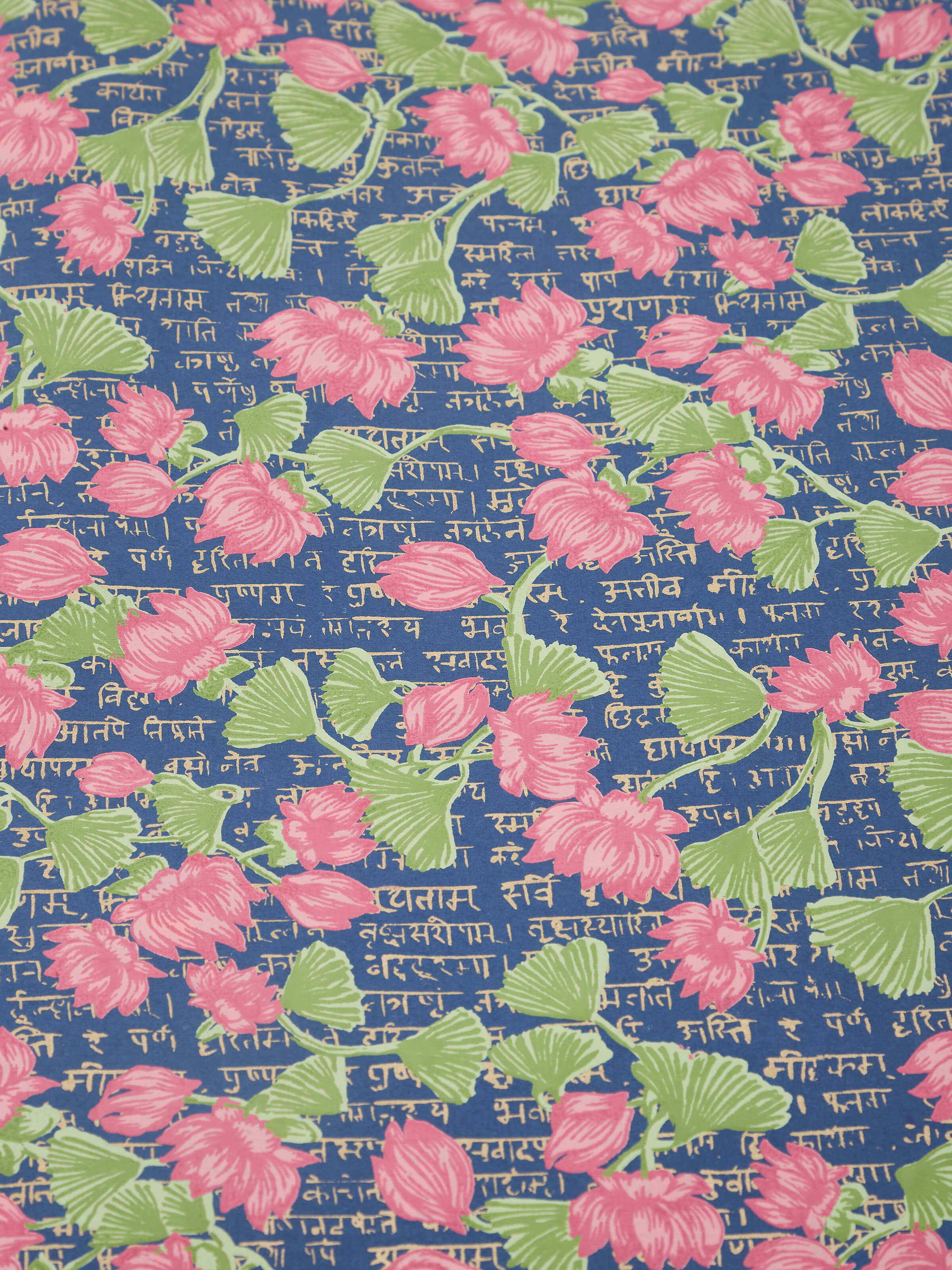 Close-up of blue handmade paper wrapping sheets, focusing on the paper's fine craftsmanship and color.