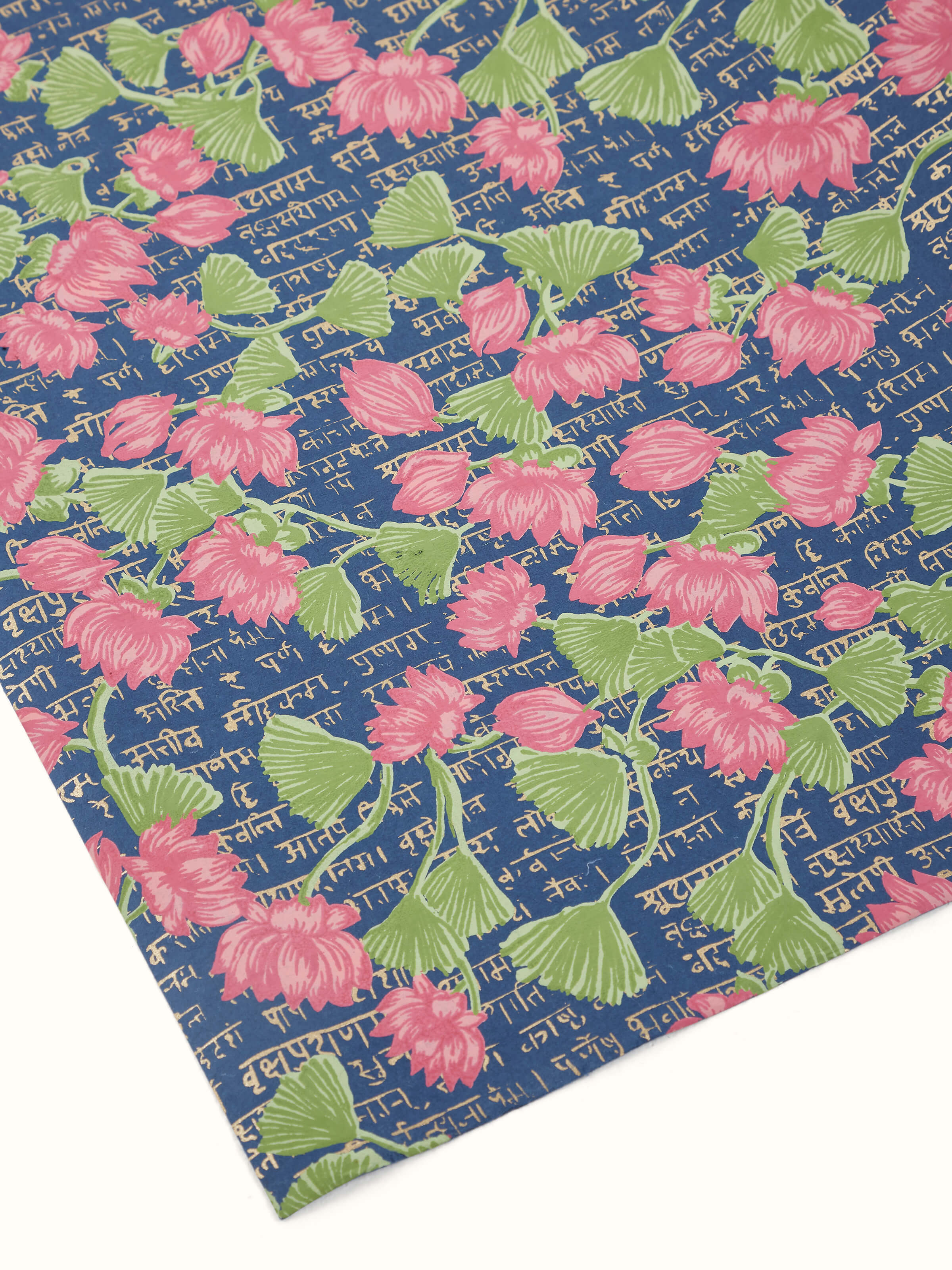 Folded view of blue handmade paper wrapping sheets, showcasing their flexibility and quality.